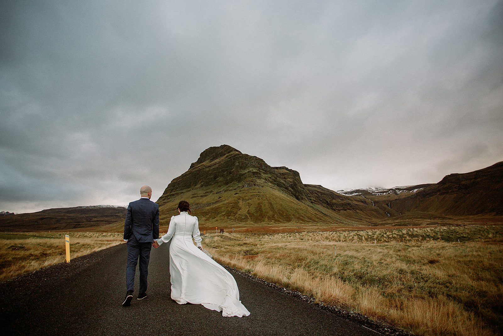 A Private Multi-Area Iceland Elopement by Steph Zakas Photography with wedding couple at mountain