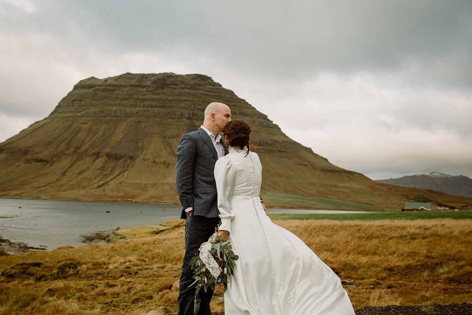 A Private Multi-Area Iceland Elopement by Steph Zakas Photography with wedding couple at mountain