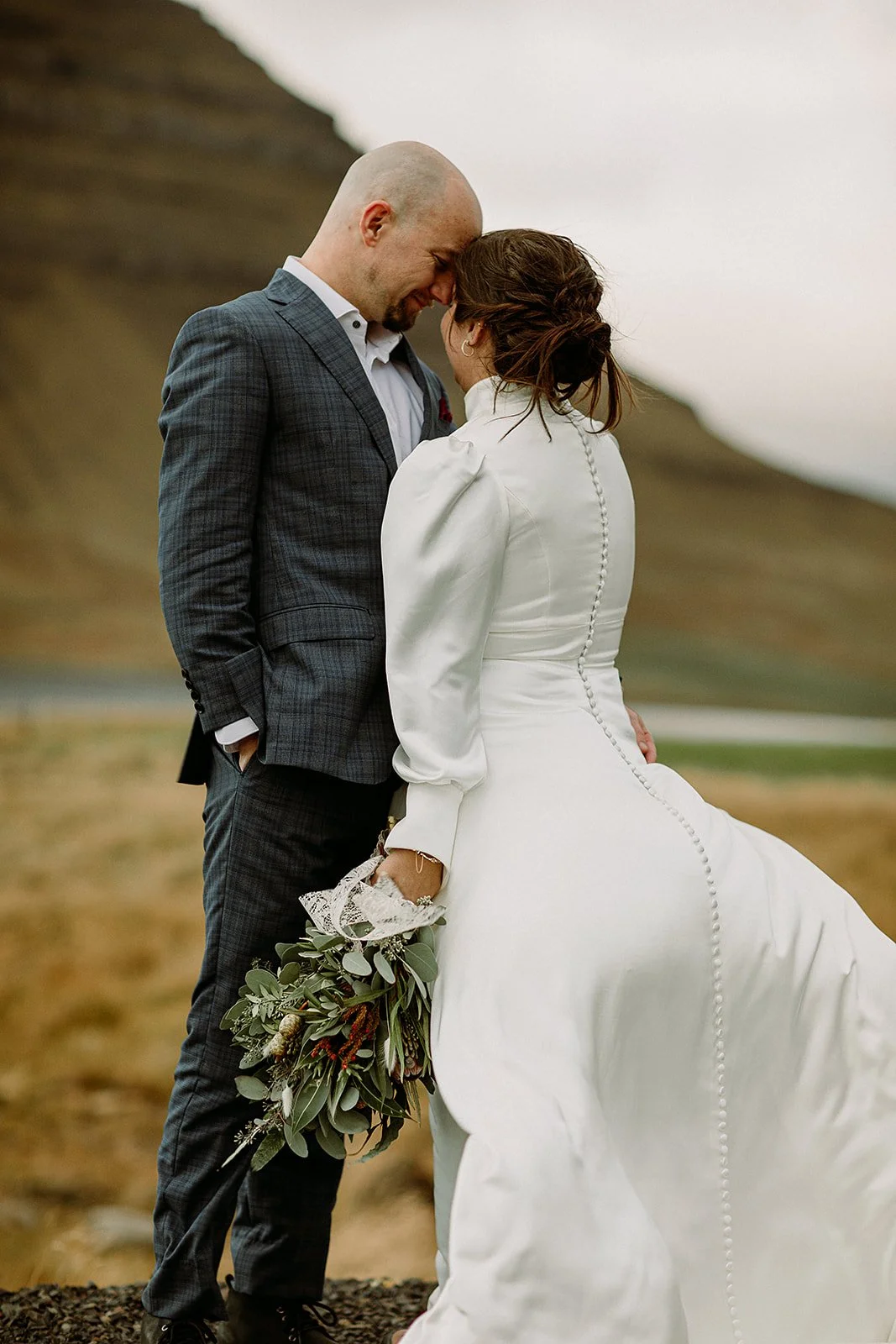 A Private Multi-Area Iceland Elopement by Steph Zakas Photography with wedding couple at mountain