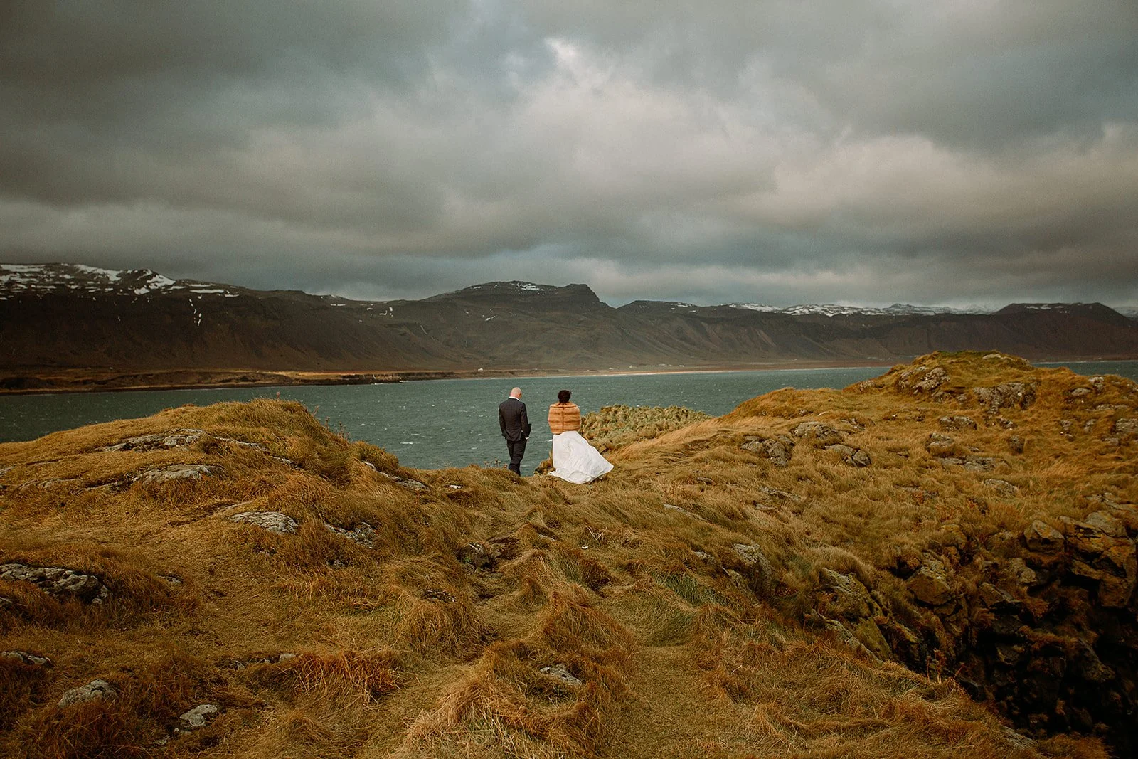 A Private Multi-Area Iceland Elopement by Steph Zakas Photography with wedding couple at sea cliff