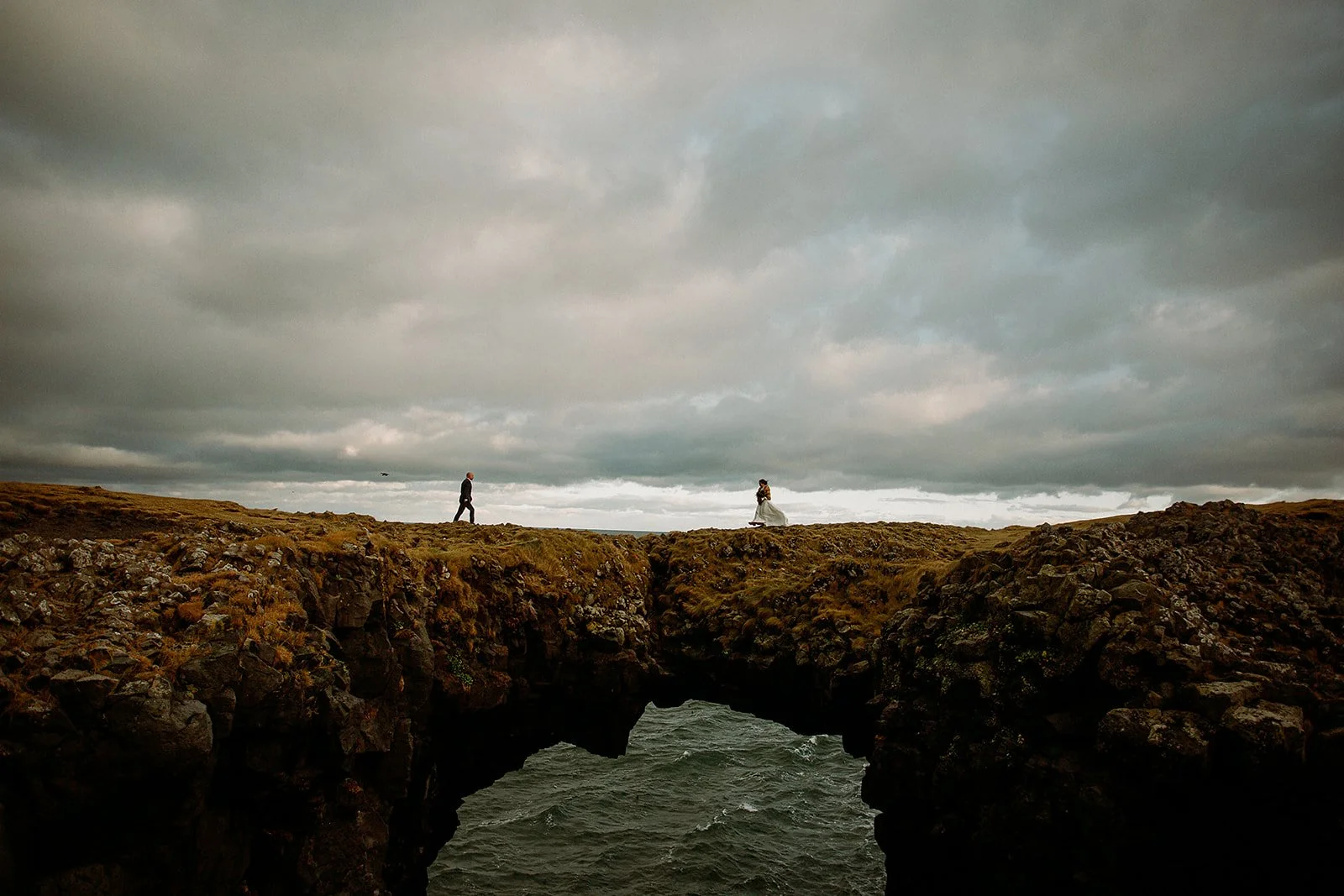 A Private Multi-Area Iceland Elopement by Steph Zakas Photography with wedding couple at sea cliff