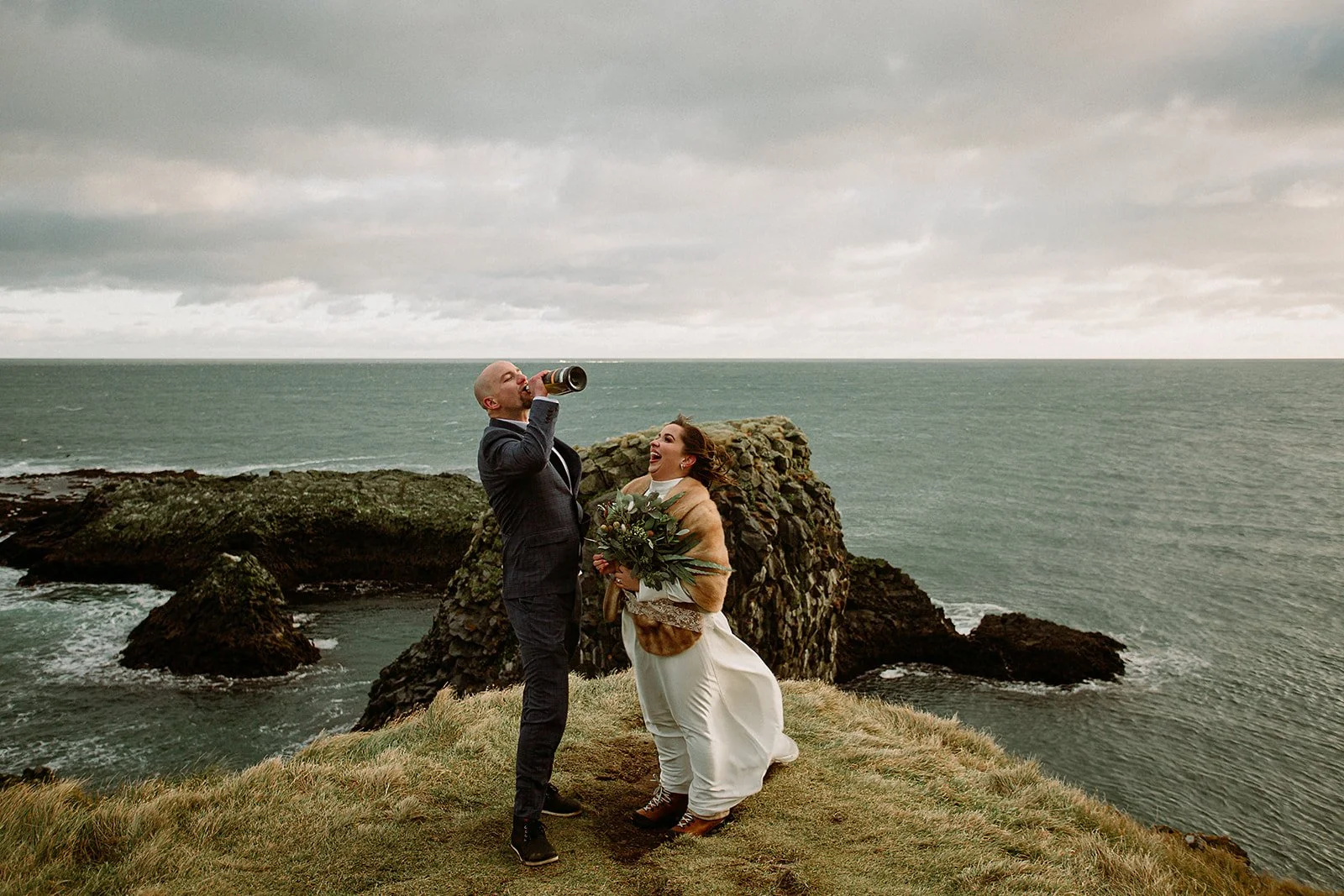 A Private Multi-Area Iceland Elopement by Steph Zakas Photography with wedding couple at sea cliff