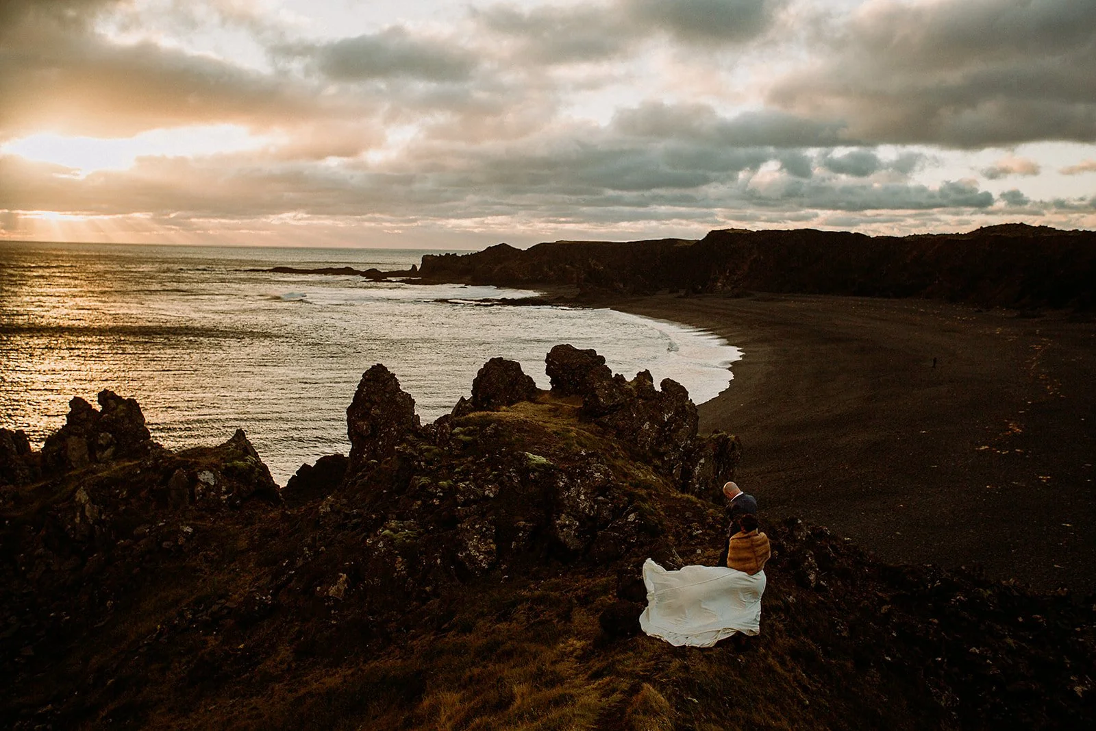 A Private Multi-Area Iceland Elopement by Steph Zakas Photography with wedding couple at sea cliff