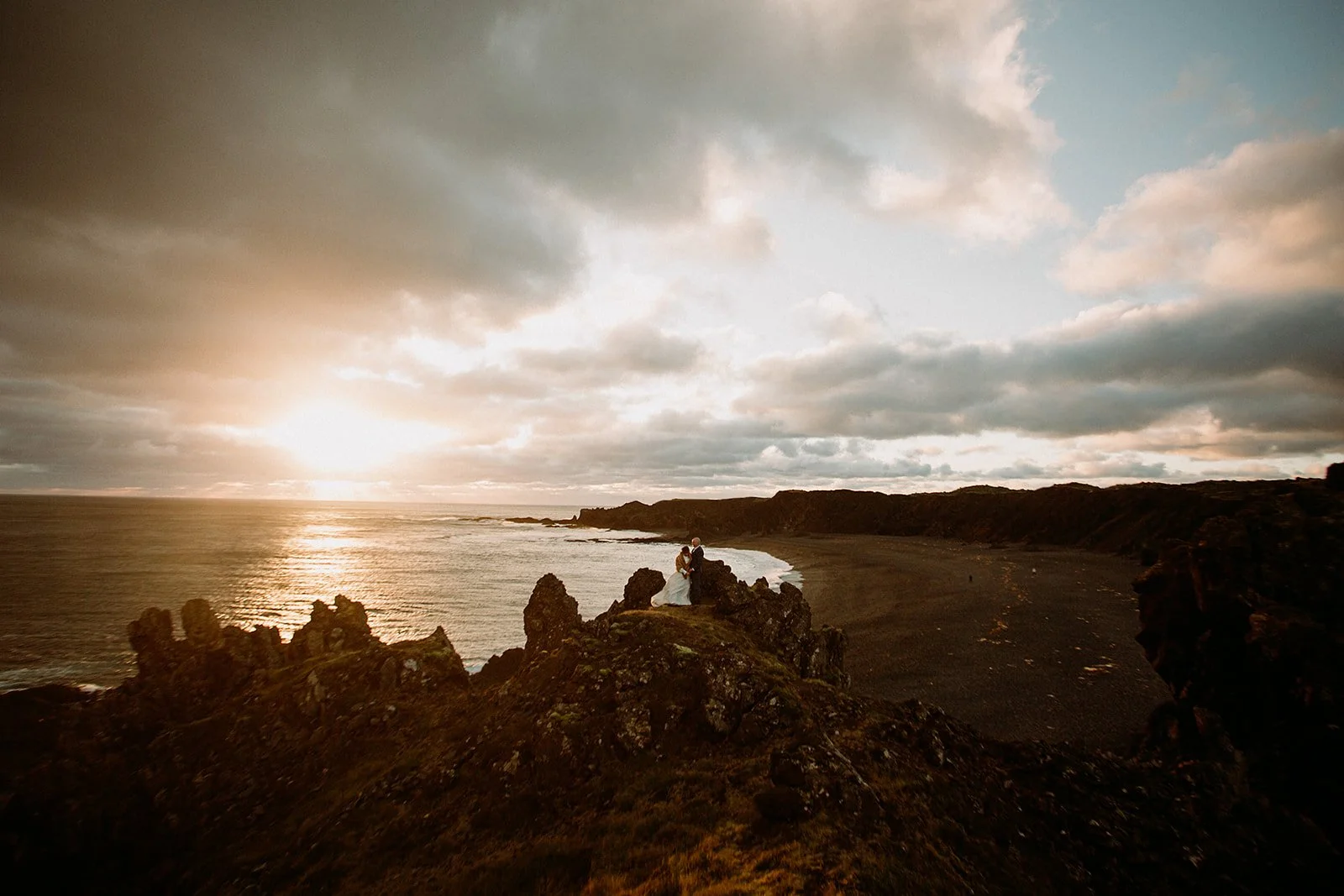 A Private Multi-Area Iceland Elopement by Steph Zakas Photography with wedding couple at sea cliff
