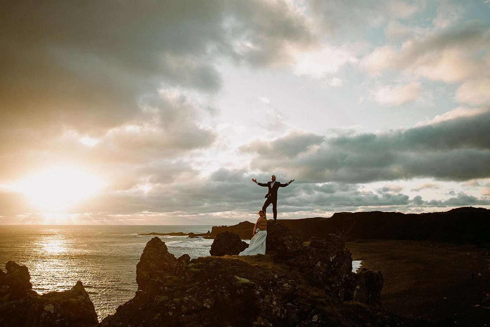 A Private Multi-Area Iceland Elopement by Steph Zakas Photography with wedding couple at sea cliff
