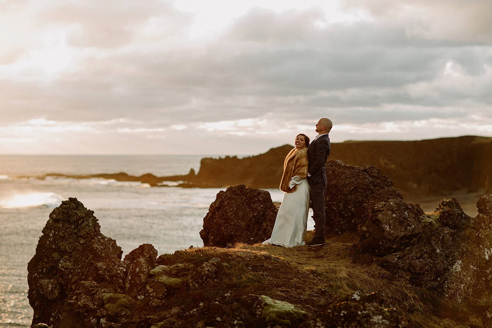 A Private Multi-Area Iceland Elopement by Steph Zakas Photography with wedding couple at sea cliff
