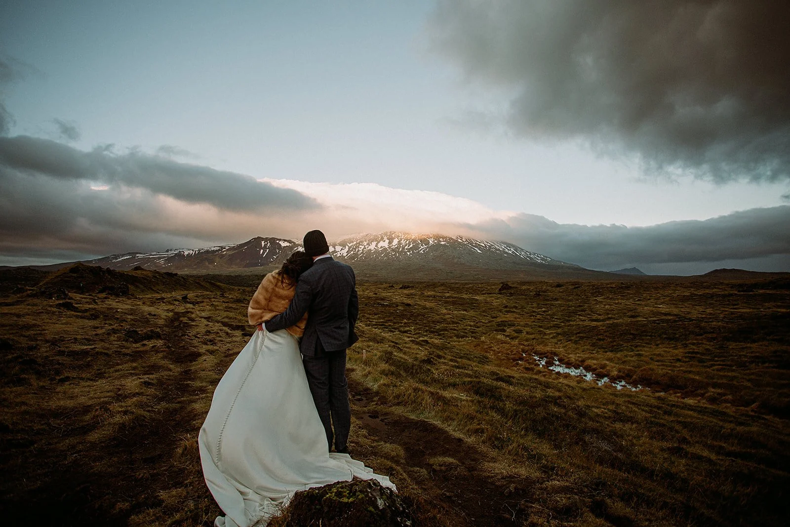 A Private Multi-Area Iceland Elopement by Steph Zakas Photography with wedding couple at sea cliff