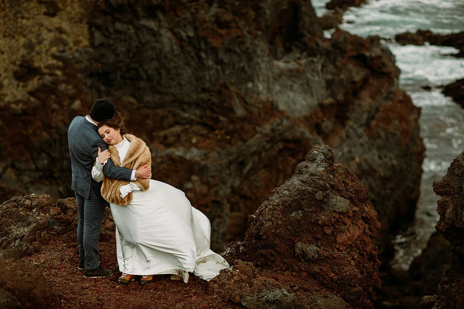 A Private Multi-Area Iceland Elopement by Steph Zakas Photography with wedding couple at sea cliff