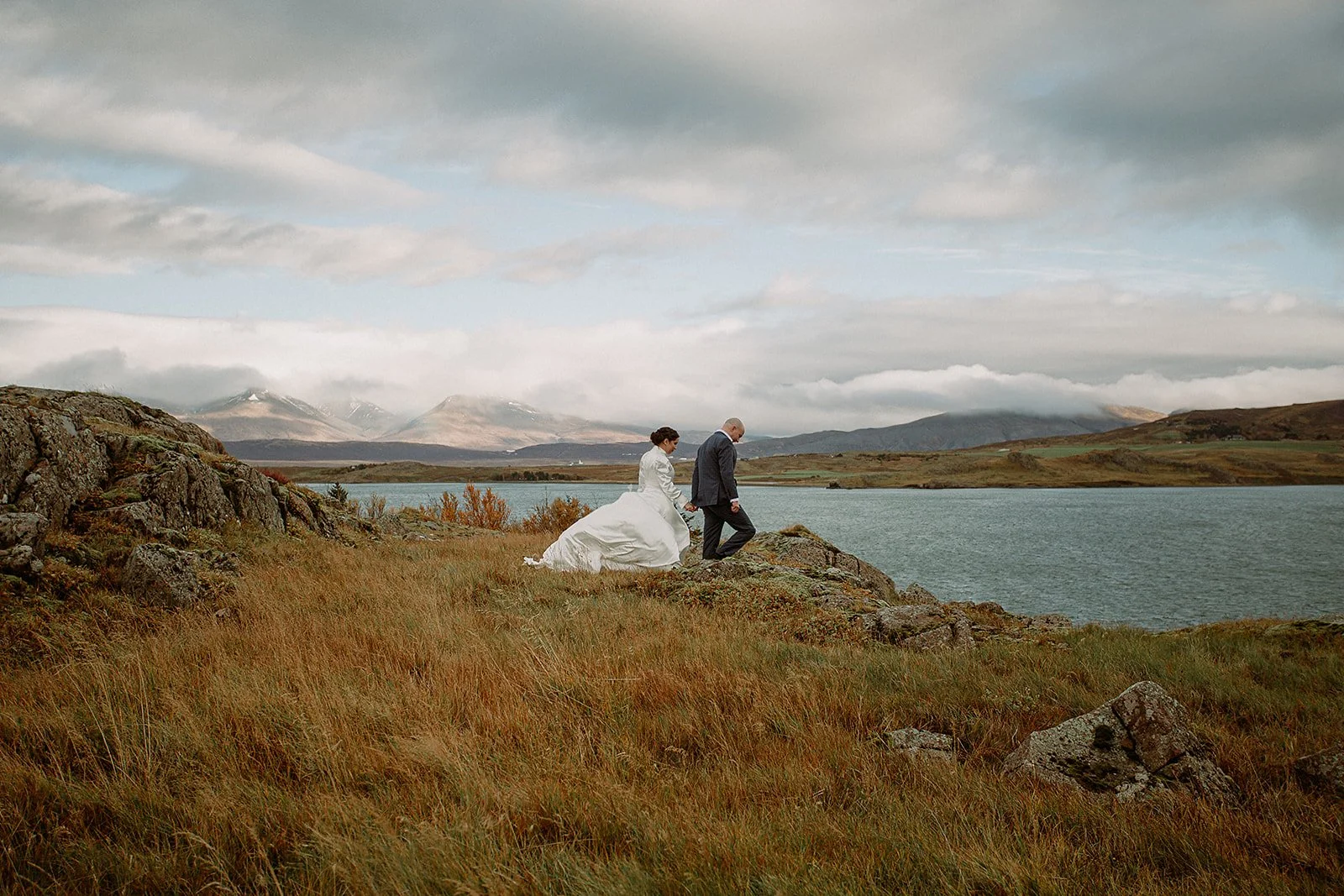 A Private Multi-Area Iceland Elopement by Steph Zakas Photography with wedding couple by fjord