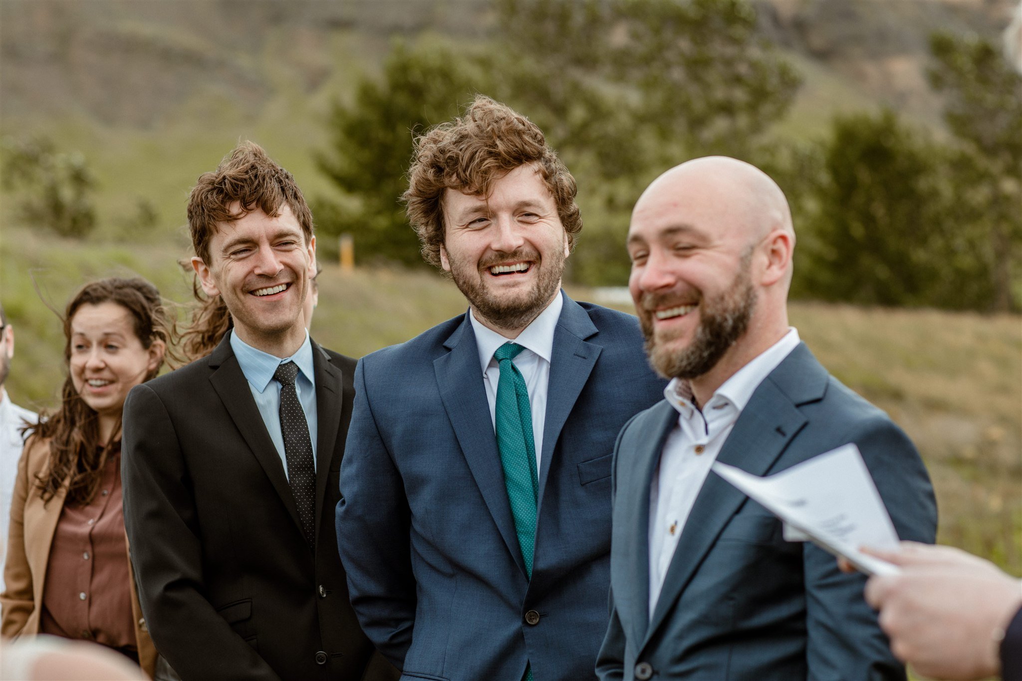  A Private Lake Iceland Elopement Starting in Reykjavík with Guests — at the private ceremony on a private lake with their guests surrounding them 