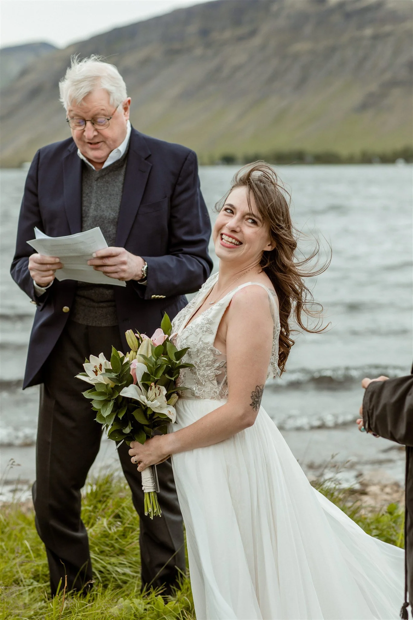  A Private Lake Iceland Elopement Starting in Reykjavík with Guests — at the private ceremony on a private lake with their guests surrounding them 