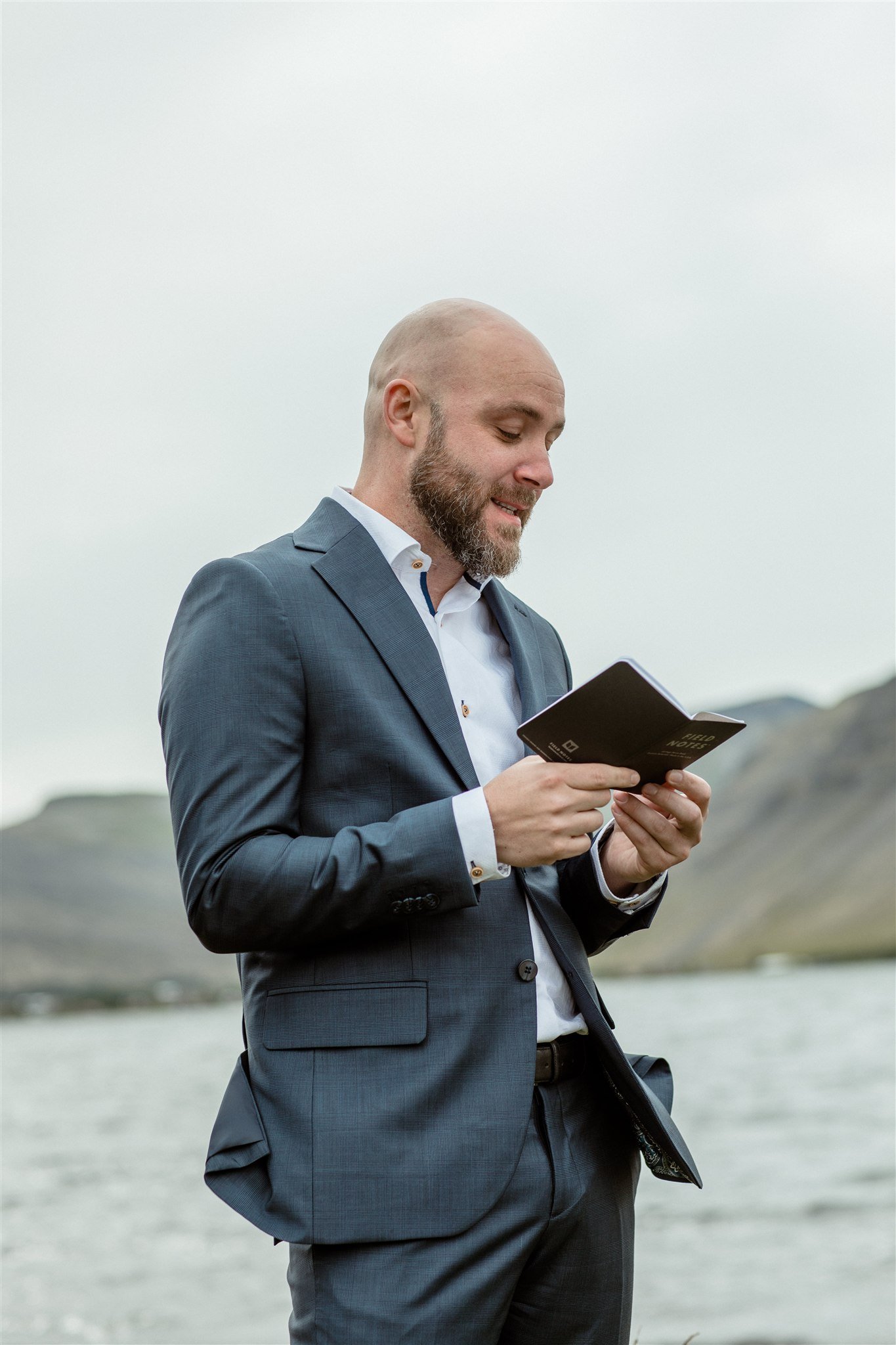  A Private Lake Iceland Elopement Starting in Reykjavík with Guests — at the private ceremony on a private lake with their guests surrounding them 