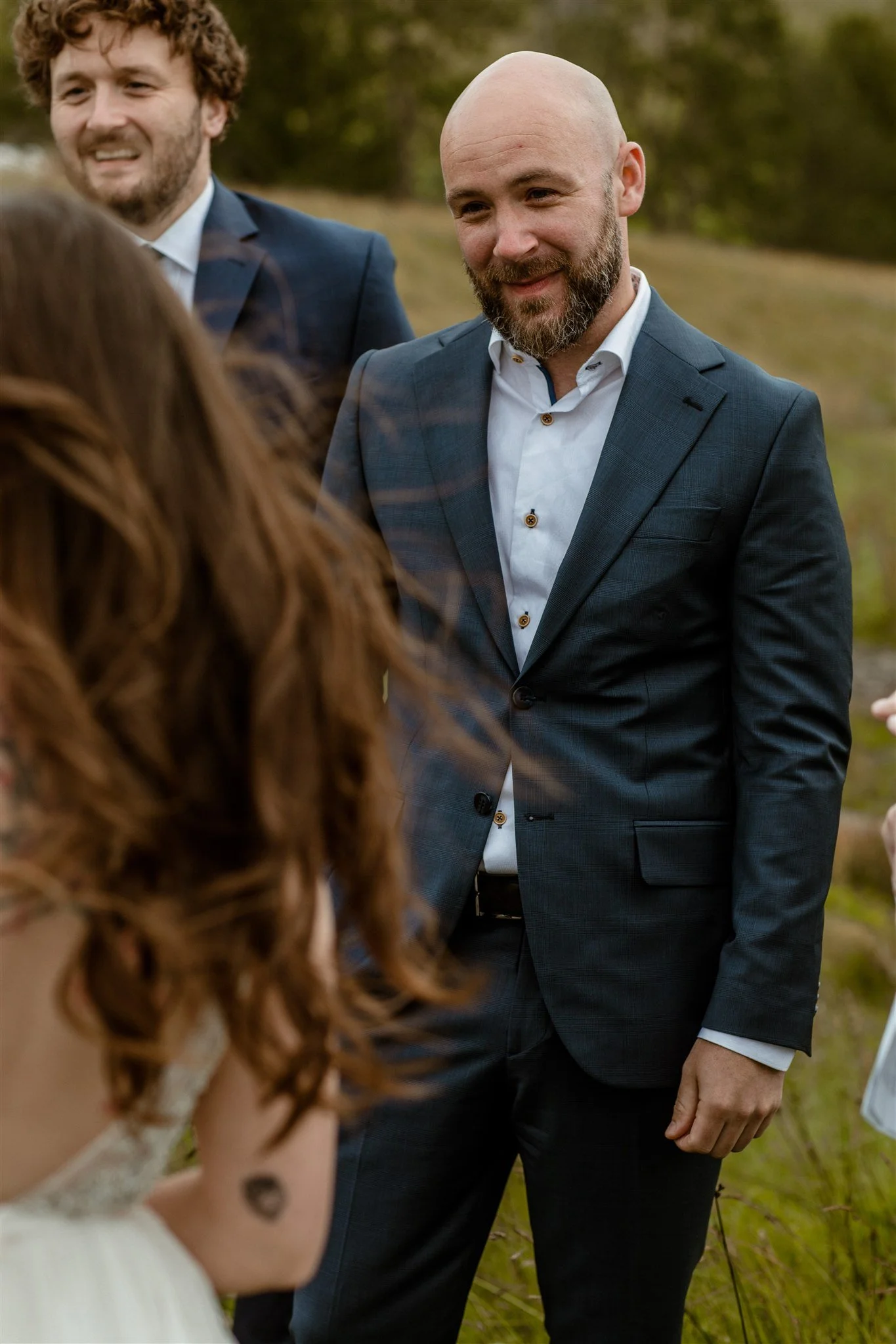  A Private Lake Iceland Elopement Starting in Reykjavík with Guests — at the private ceremony on a private lake with their guests surrounding them 