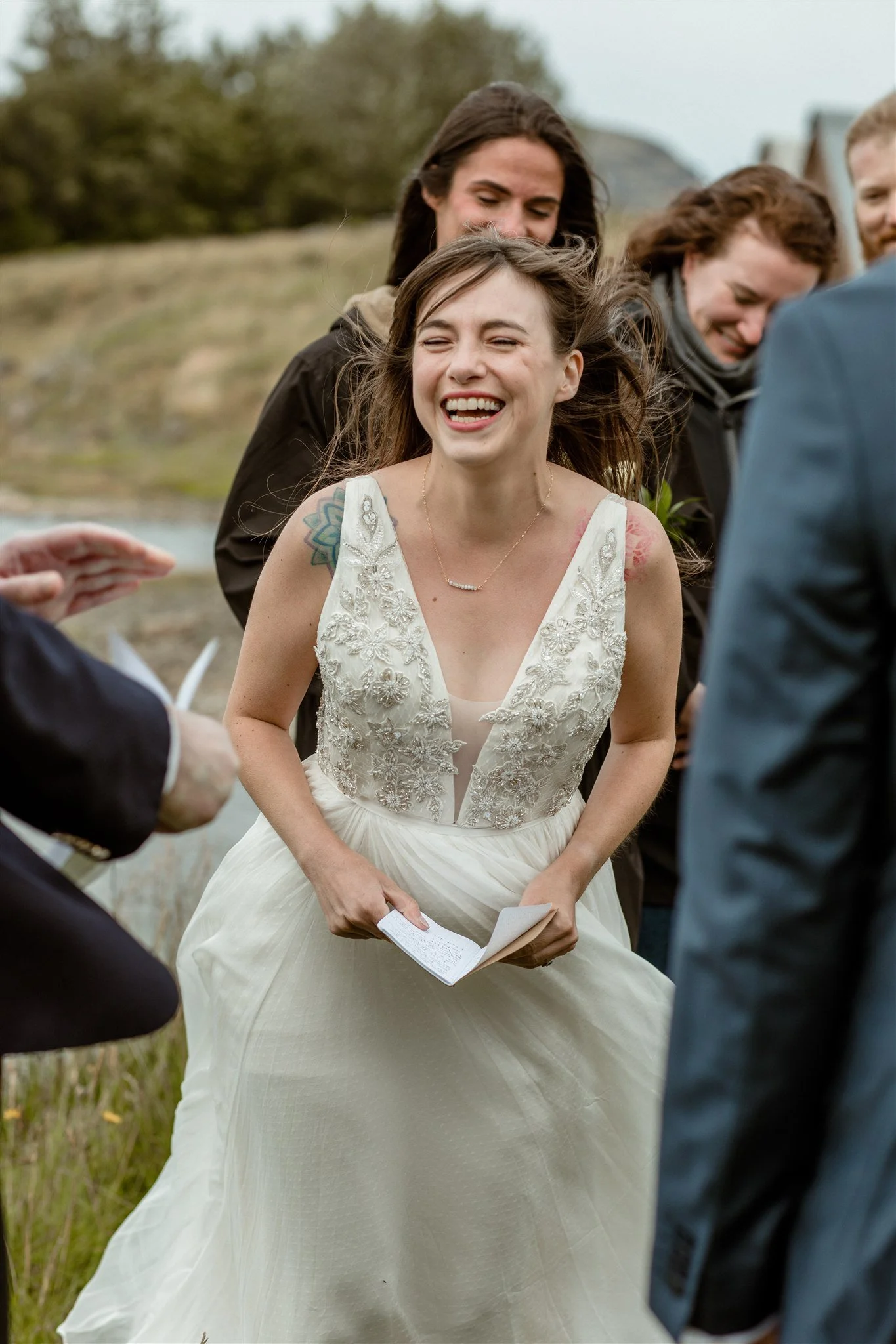  A Private Lake Iceland Elopement Starting in Reykjavík with Guests — at the private ceremony on a private lake with their guests surrounding them 