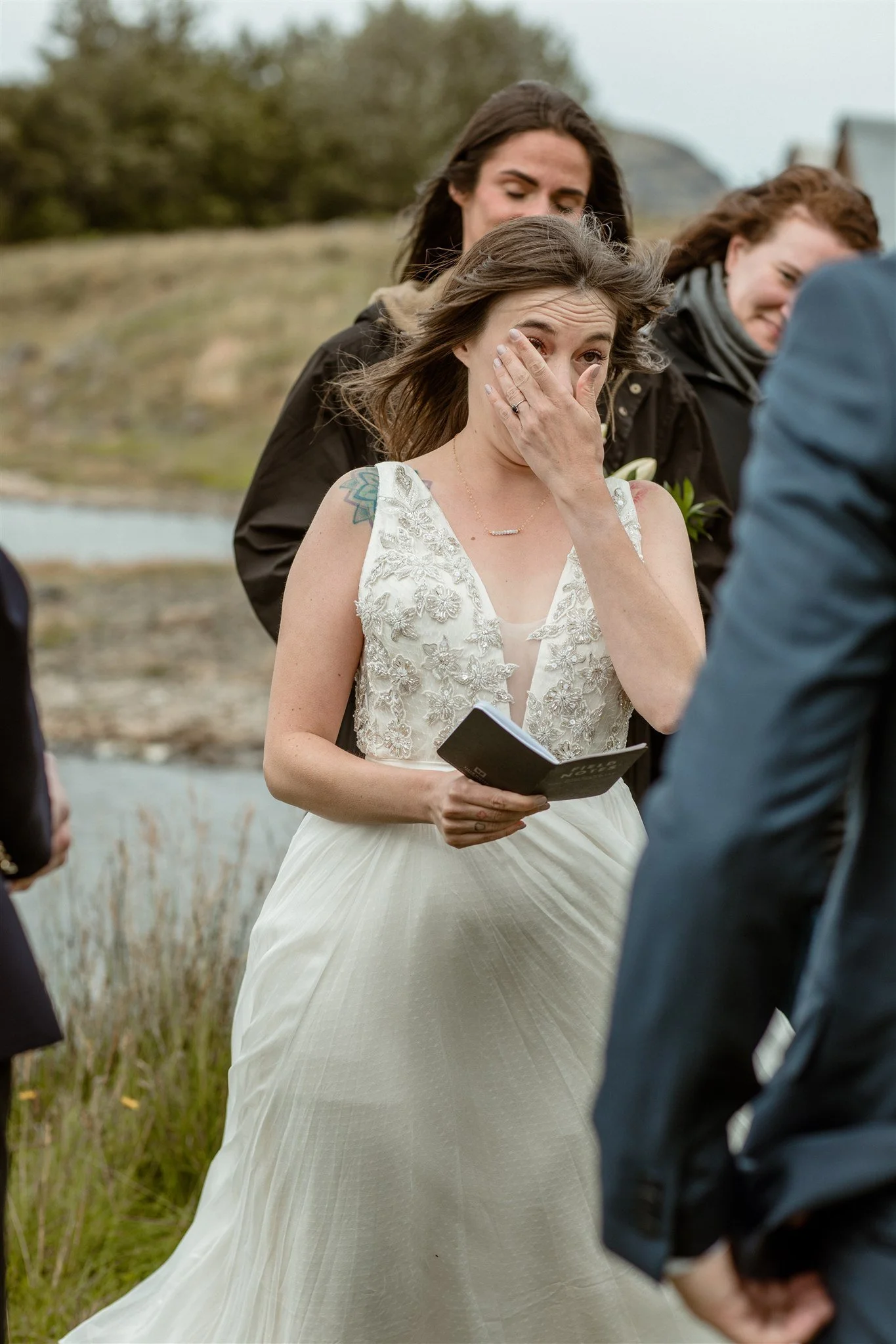  A Private Lake Iceland Elopement Starting in Reykjavík with Guests — at the private ceremony on a private lake with their guests surrounding them 