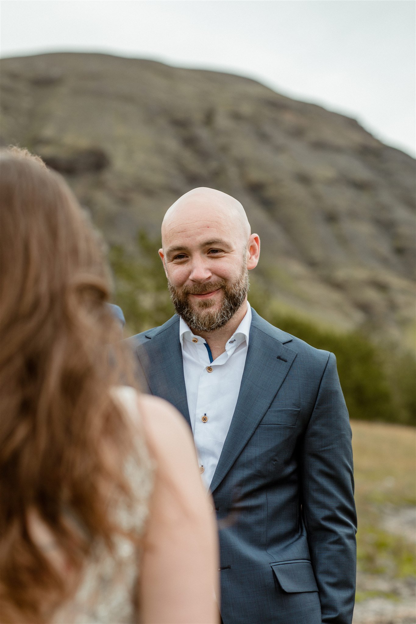  A Private Lake Iceland Elopement Starting in Reykjavík with Guests — at the private ceremony on a private lake with their guests surrounding them 
