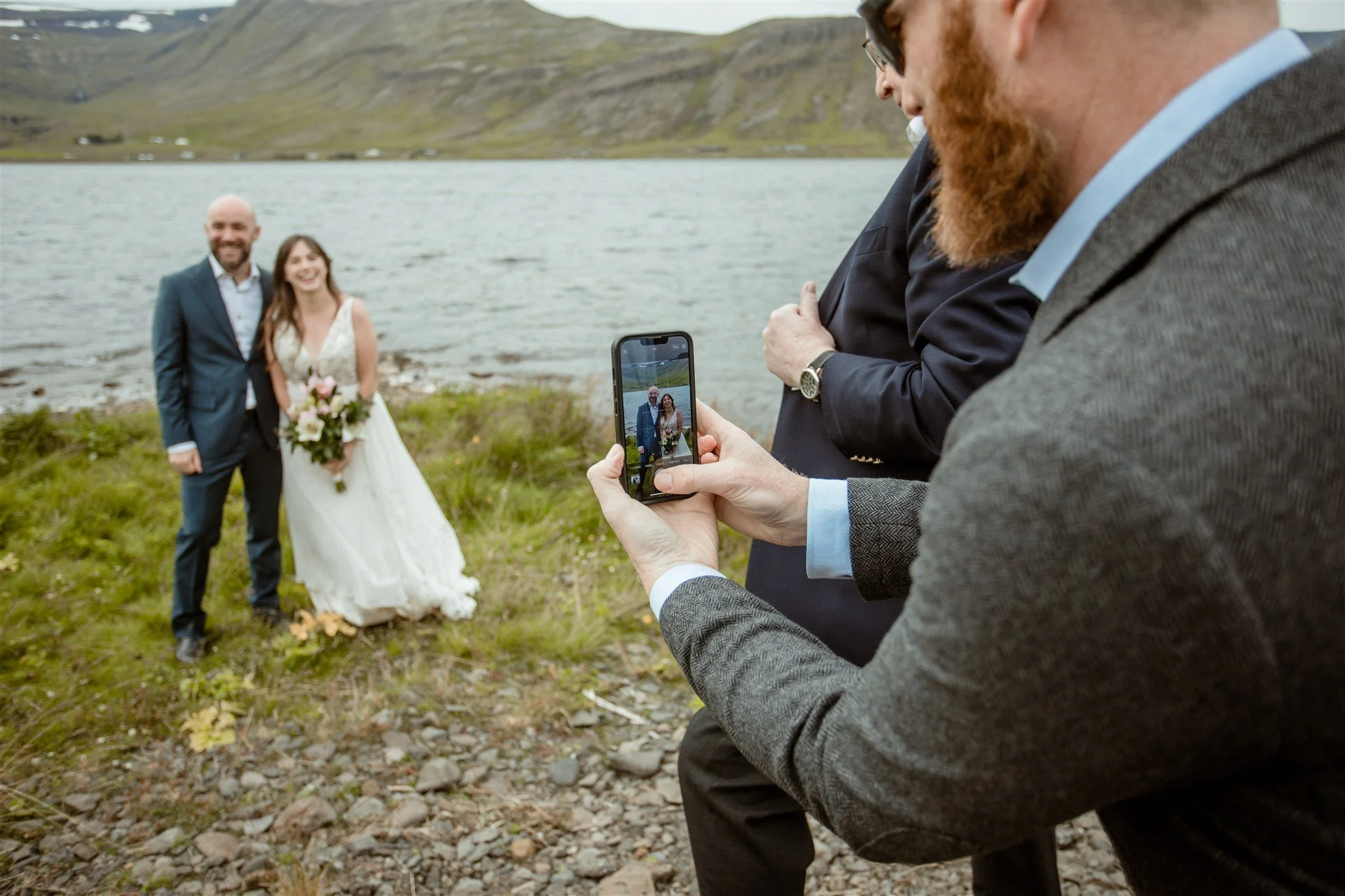  A Private Lake Iceland Elopement Starting in Reykjavík with Guests — couple after ceremony  