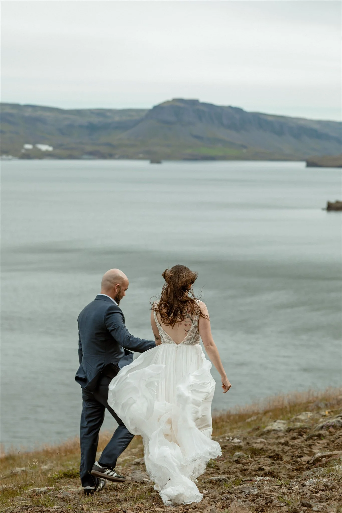  A Private Lake Iceland Elopement Starting in Reykjavík with Guests by Iceland elopement photographer &amp; planner Steph Zakas — couple on an adventure for elopement photos at a fjord  