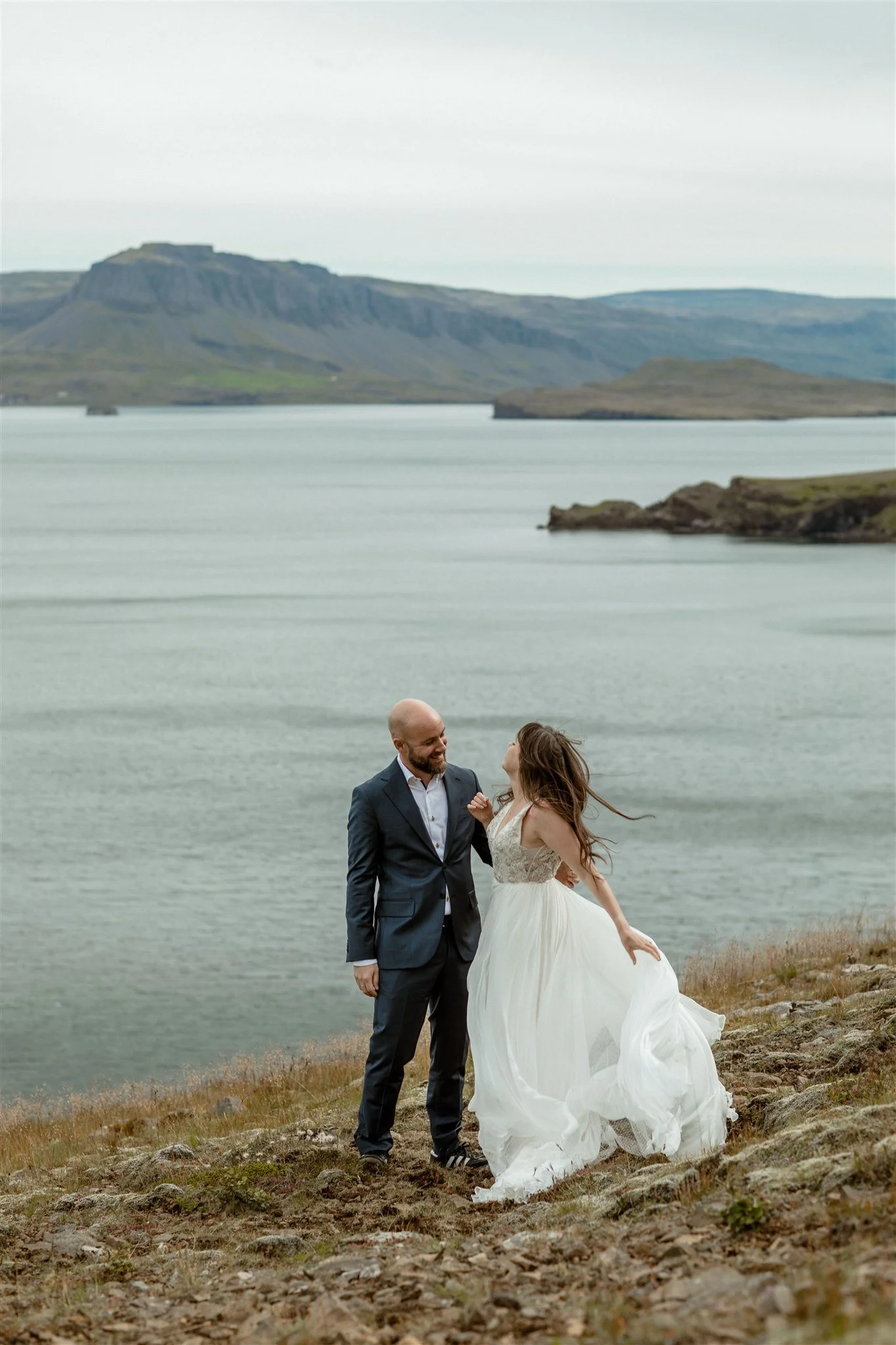  A Private Lake Iceland Elopement Starting in Reykjavík with Guests by Iceland elopement photographer &amp; planner Steph Zakas — couple on an adventure for elopement photos at a fjord  