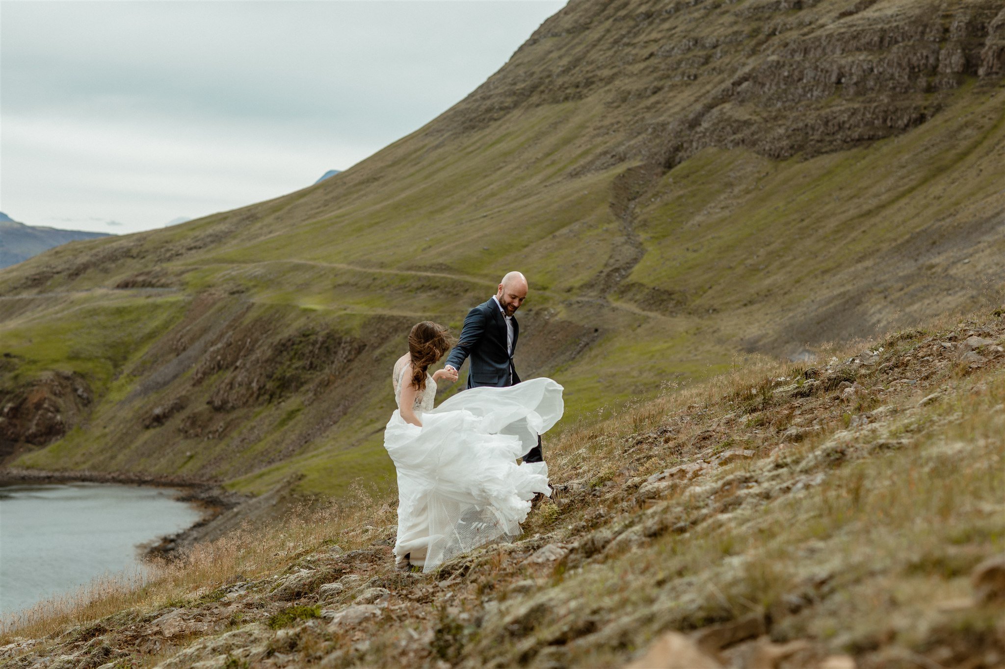  A Private Lake Iceland Elopement Starting in Reykjavík with Guests by Iceland elopement photographer &amp; planner Steph Zakas — couple on an adventure for elopement photos at a fjord  