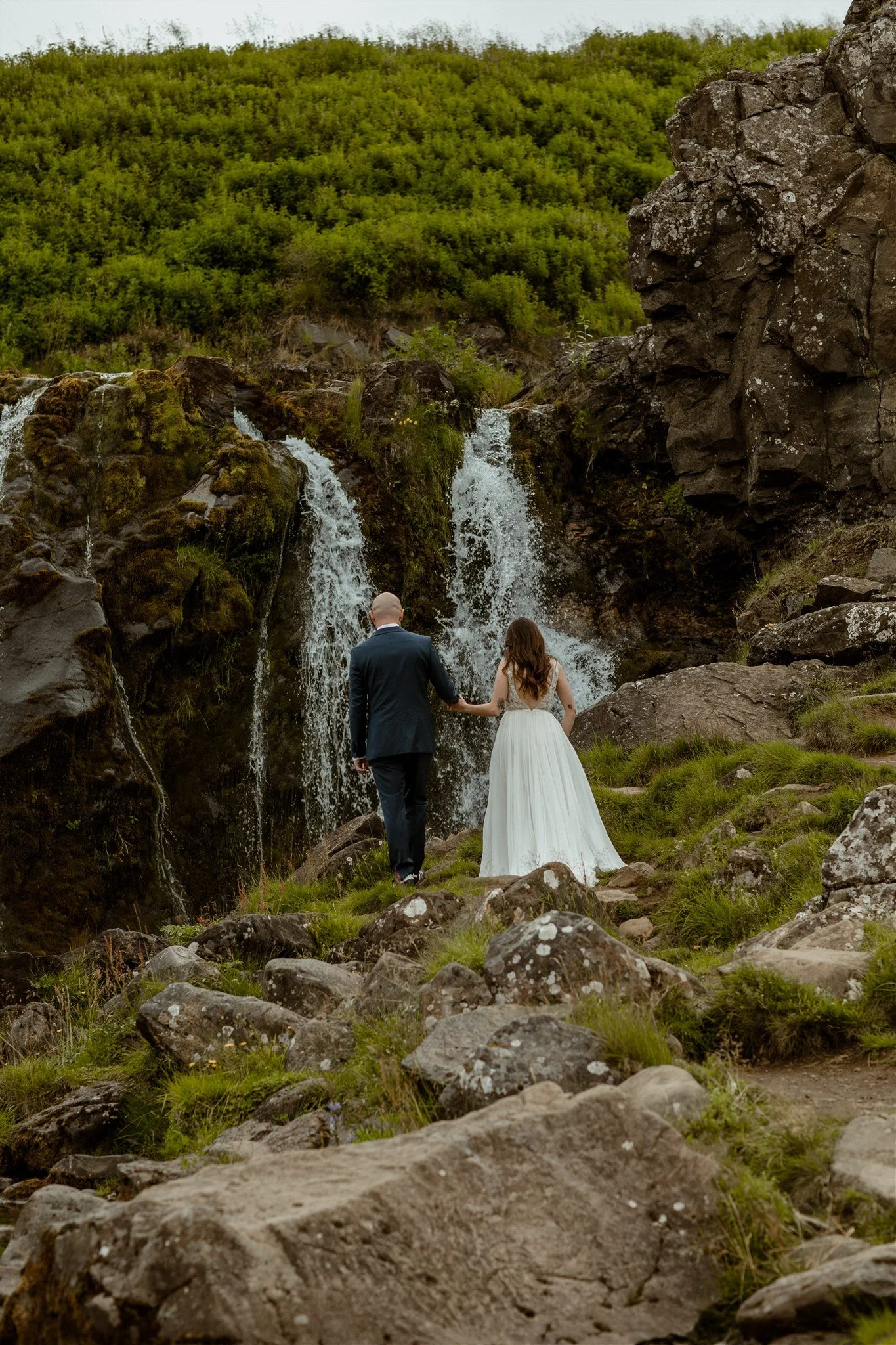  A Private Lake Iceland Elopement Starting in Reykjavík with Guests by Iceland elopement photographer &amp; planner Steph Zakas — couple on an adventure for elopement photos at a private waterfall 
