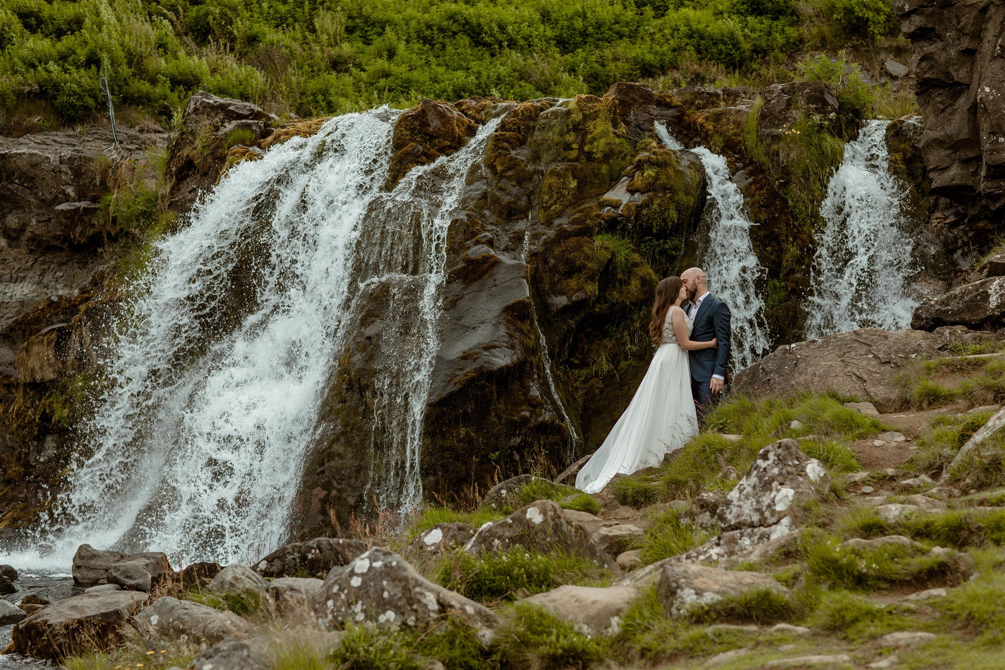  A Private Lake Iceland Elopement Starting in Reykjavík with Guests by Iceland elopement photographer &amp; planner Steph Zakas — couple on an adventure for elopement photos at a private waterfall 