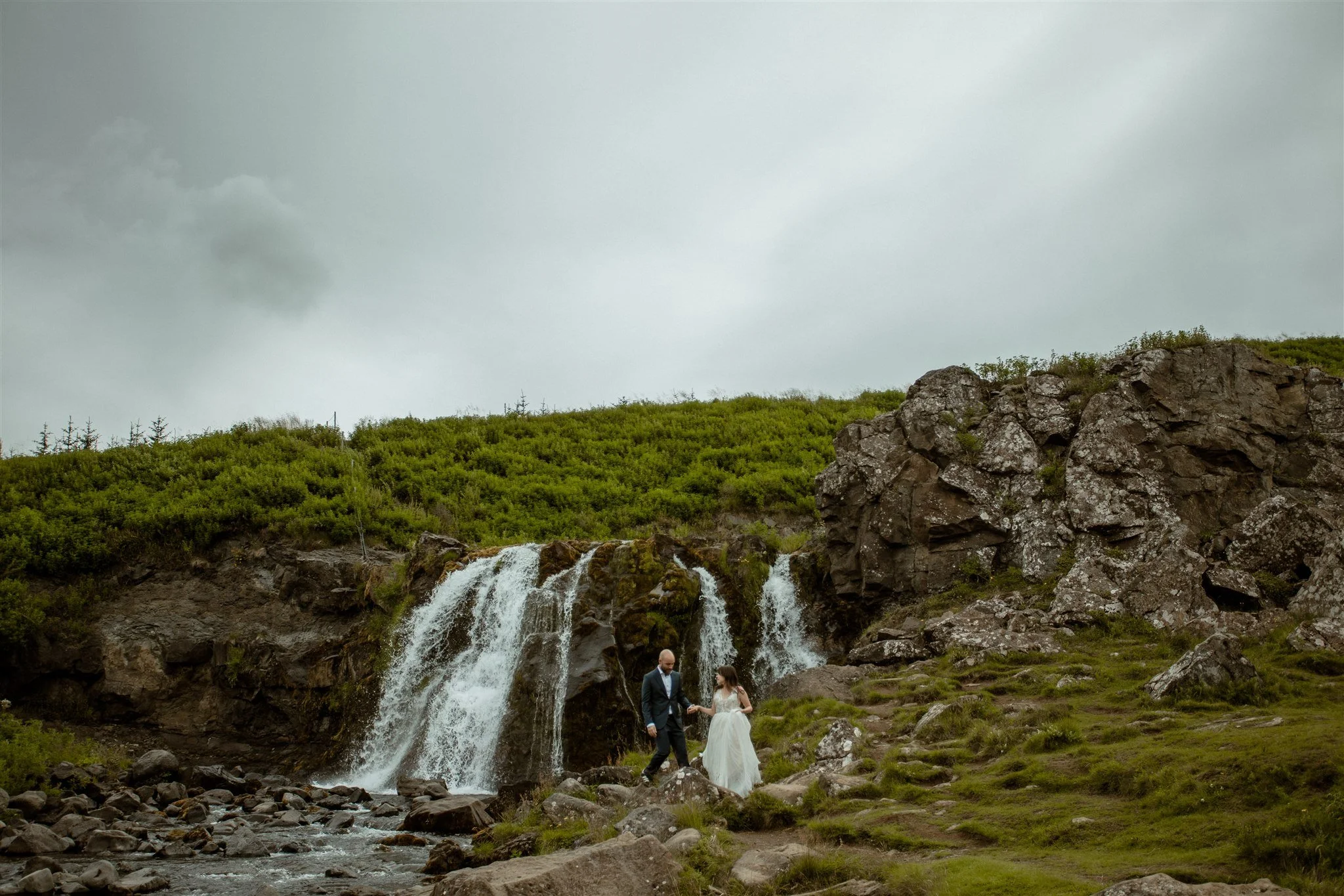  A Private Lake Iceland Elopement Starting in Reykjavík with Guests by Iceland elopement photographer &amp; planner Steph Zakas — couple on an adventure for elopement photos at a private waterfall 