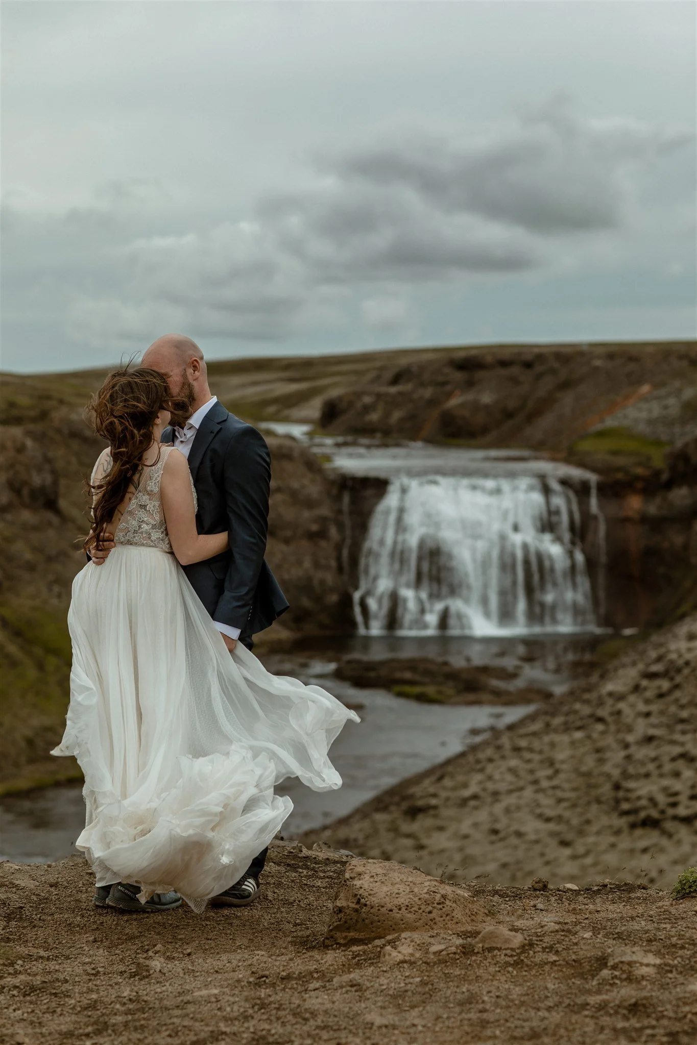  A Private Lake Iceland Elopement Starting in Reykjavík with Guests by Iceland elopement photographer &amp; planner Steph Zakas — couple on an adventure for elopement photos at a private waterfall 