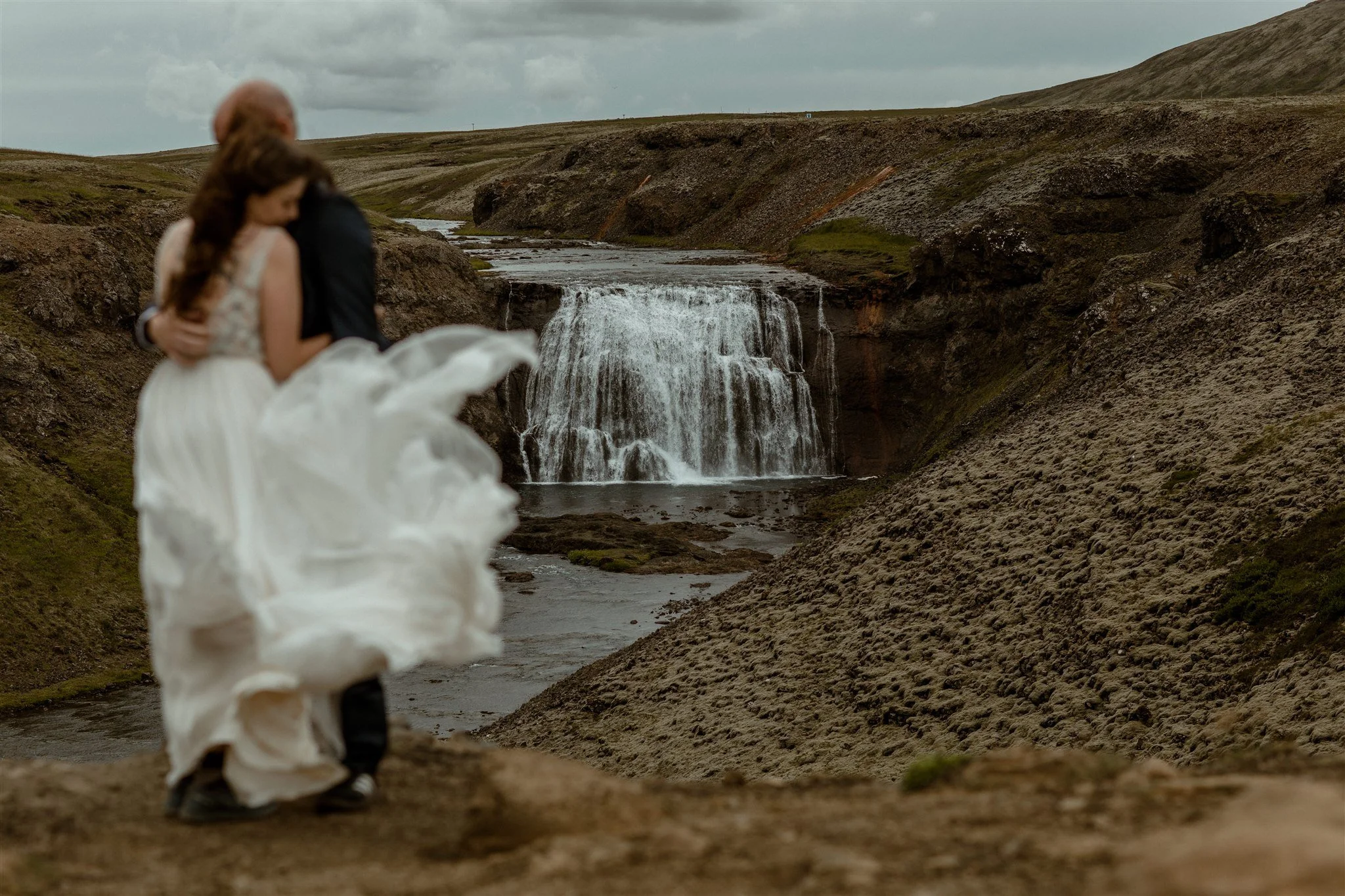  A Private Lake Iceland Elopement Starting in Reykjavík with Guests by Iceland elopement photographer &amp; planner Steph Zakas — couple on an adventure for elopement photos at a private waterfall 