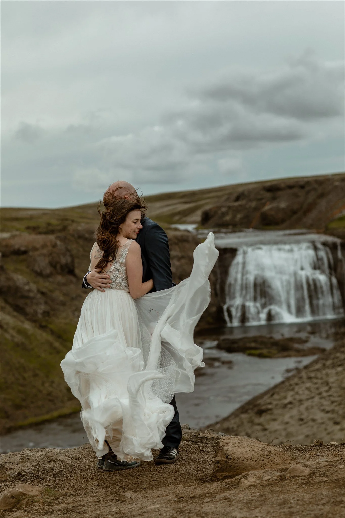  A Private Lake Iceland Elopement Starting in Reykjavík with Guests by Iceland elopement photographer &amp; planner Steph Zakas — couple on an adventure for elopement photos at a private waterfall 