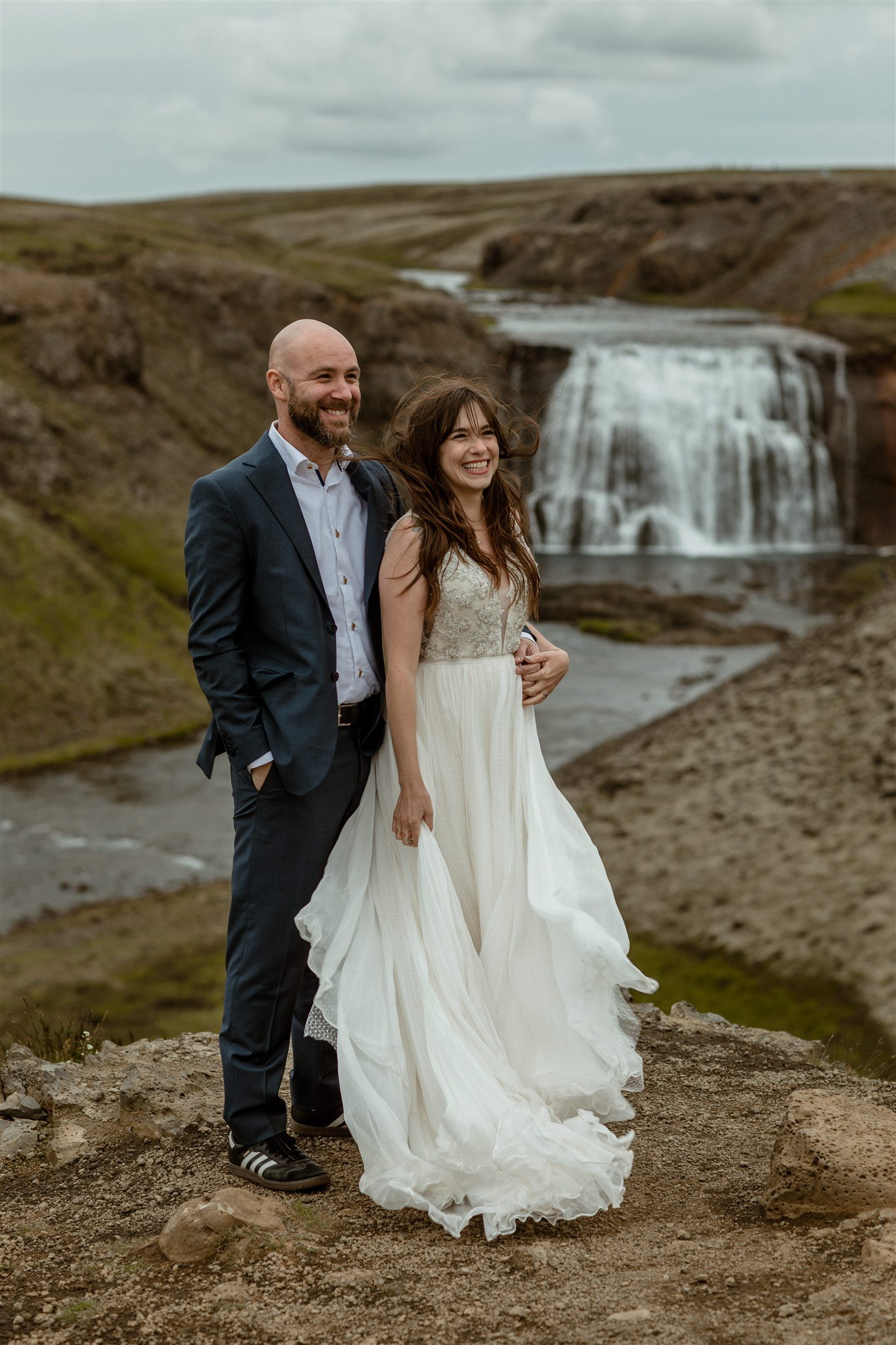  A Private Lake Iceland Elopement Starting in Reykjavík with Guests by Iceland elopement photographer &amp; planner Steph Zakas — couple on an adventure for elopement photos at a private waterfall 