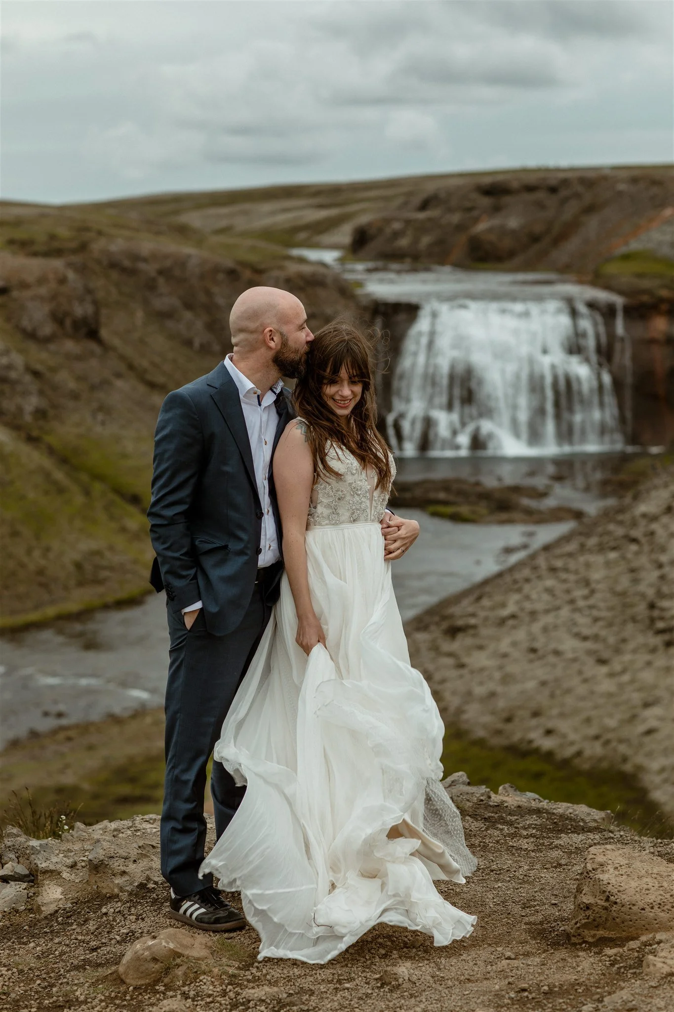  A Private Lake Iceland Elopement Starting in Reykjavík with Guests by Iceland elopement photographer &amp; planner Steph Zakas — couple on an adventure for elopement photos at a private waterfall 