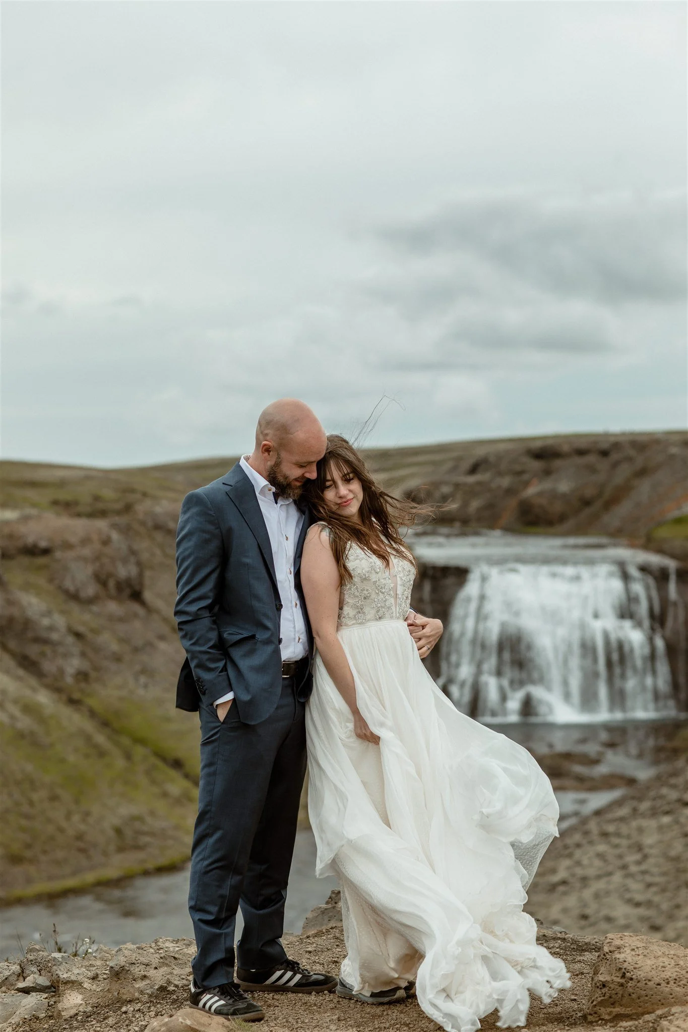  A Private Lake Iceland Elopement Starting in Reykjavík with Guests by Iceland elopement photographer &amp; planner Steph Zakas — couple on an adventure for elopement photos at a private waterfall 