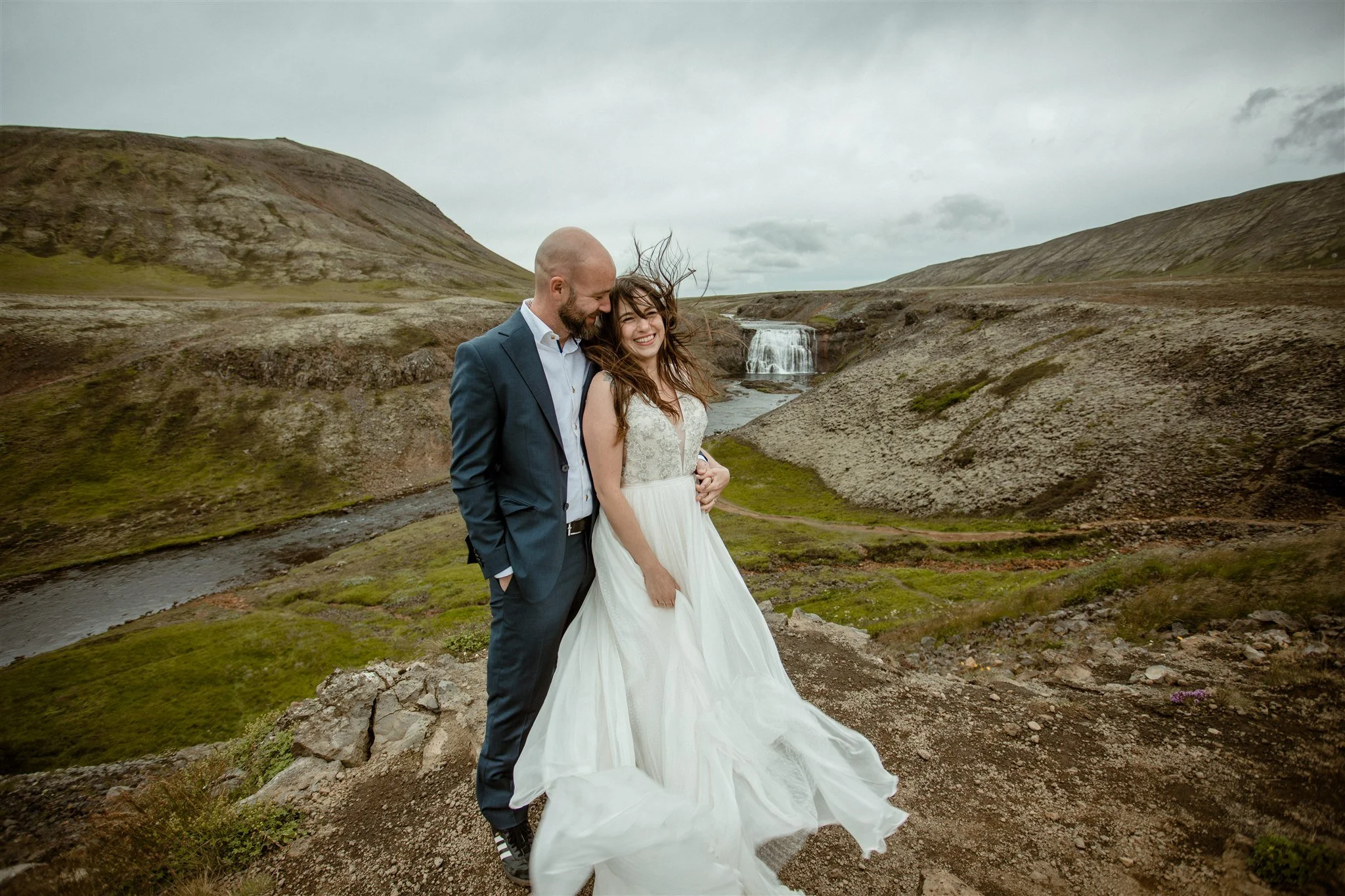  A Private Lake Iceland Elopement Starting in Reykjavík with Guests by Iceland elopement photographer &amp; planner Steph Zakas — couple on an adventure for elopement photos at a private waterfall 