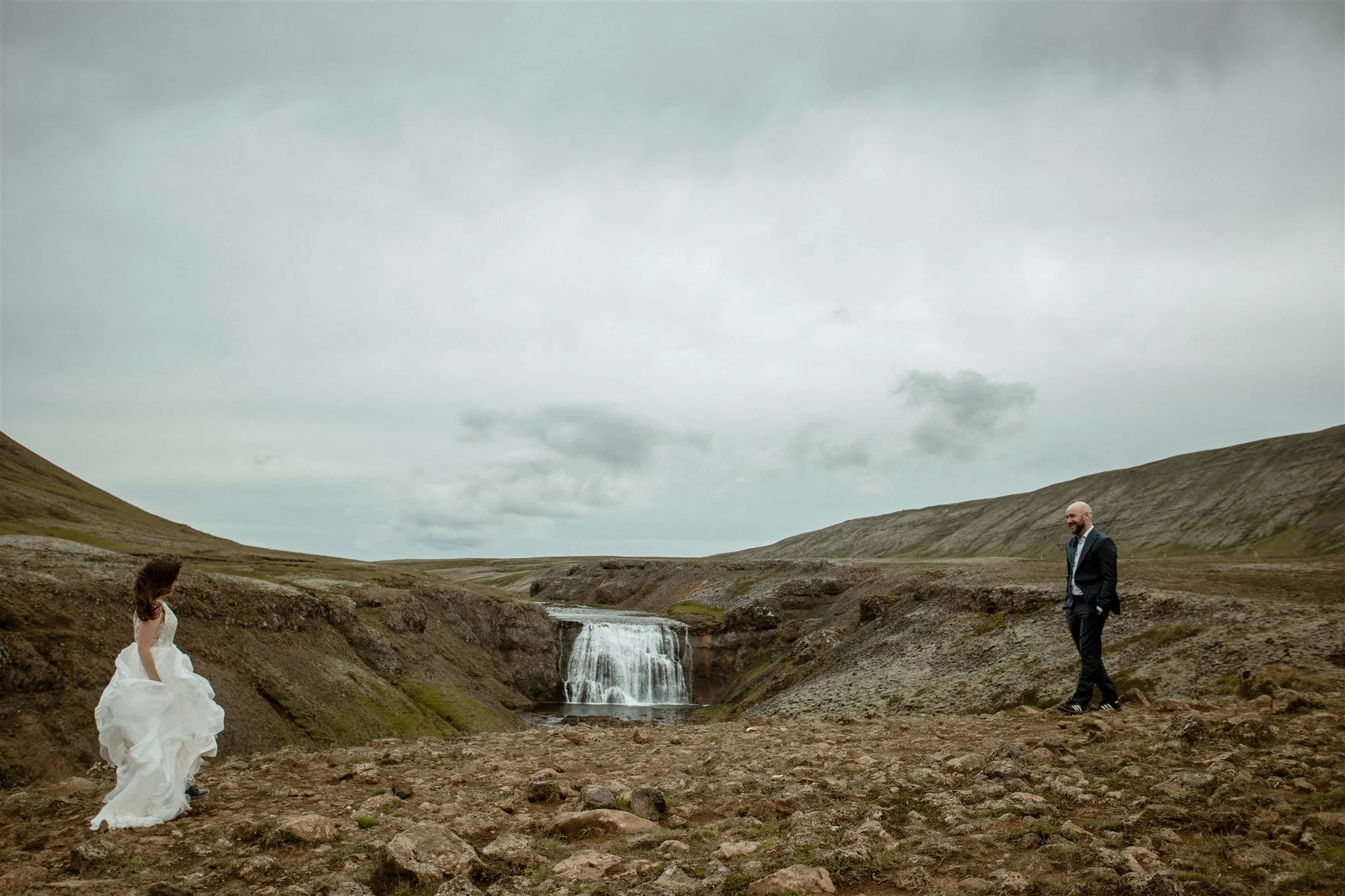  A Private Lake Iceland Elopement Starting in Reykjavík with Guests by Iceland elopement photographer &amp; planner Steph Zakas — couple on an adventure for elopement photos at a private waterfall 
