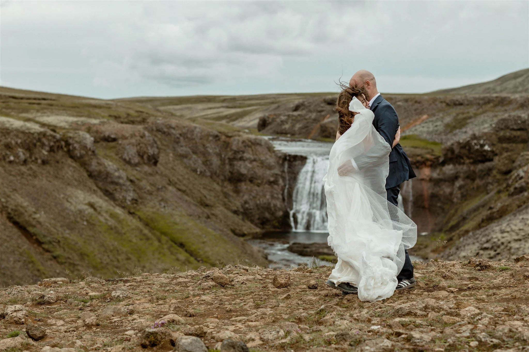 A Private Lake Iceland Elopement Starting in Reykjavík with Guests by Iceland elopement photographer &amp; planner Steph Zakas — couple on an adventure for elopement photos at a private waterfall 