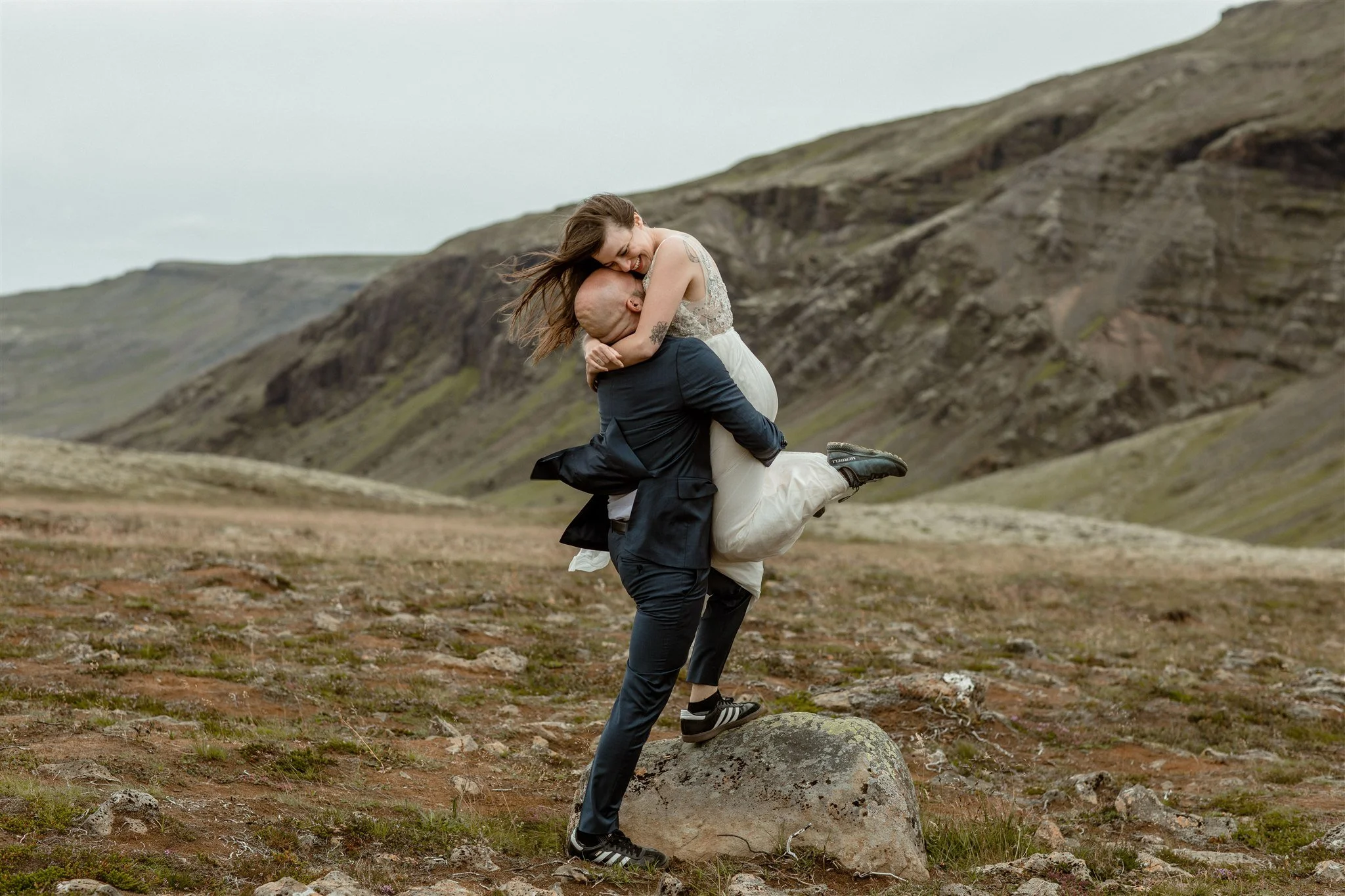  A Private Lake Iceland Elopement Starting in Reykjavík with Guests by Iceland elopement photographer &amp; planner Steph Zakas — couple on an adventure for elopement photos at a volcanic area 