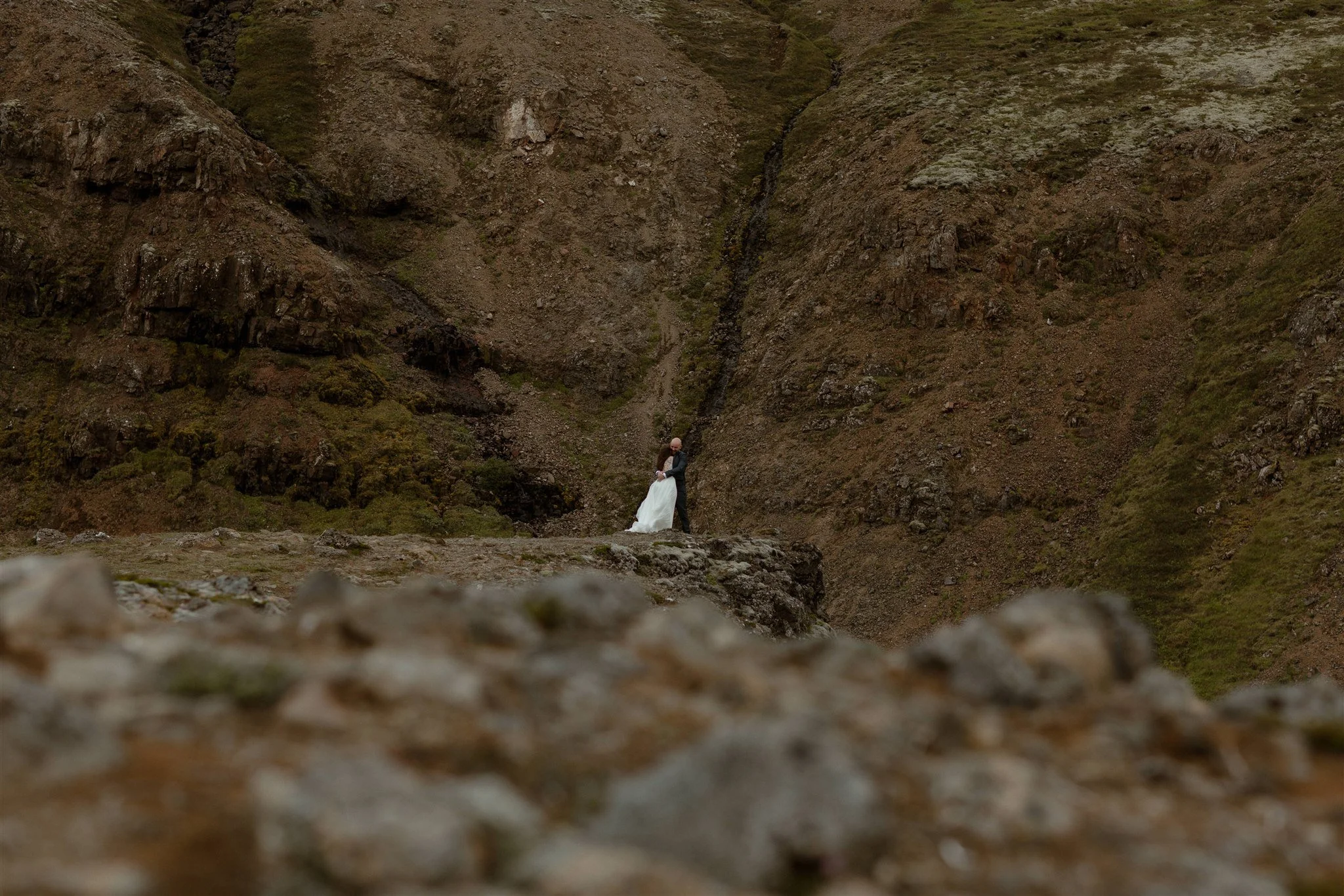  A Private Lake Iceland Elopement Starting in Reykjavík with Guests by Iceland elopement photographer &amp; planner Steph Zakas — couple on an adventure for elopement photos at a volcanic area 