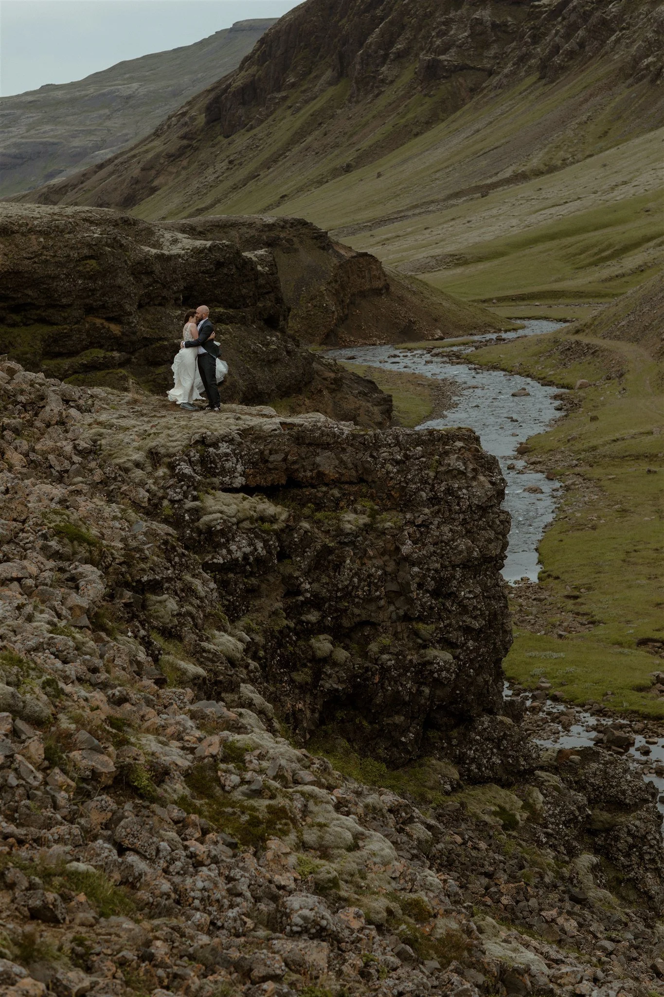  A Private Lake Iceland Elopement Starting in Reykjavík with Guests by Iceland elopement photographer &amp; planner Steph Zakas — couple on an adventure for elopement photos at a volcanic area 