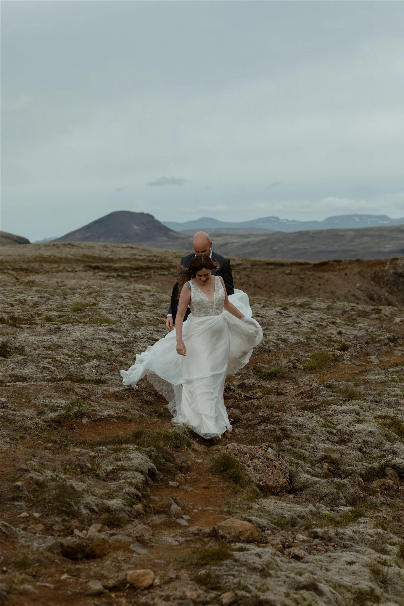  A Private Lake Iceland Elopement Starting in Reykjavík with Guests by Iceland elopement photographer &amp; planner Steph Zakas — couple on an adventure for elopement photos at a volcanic area 