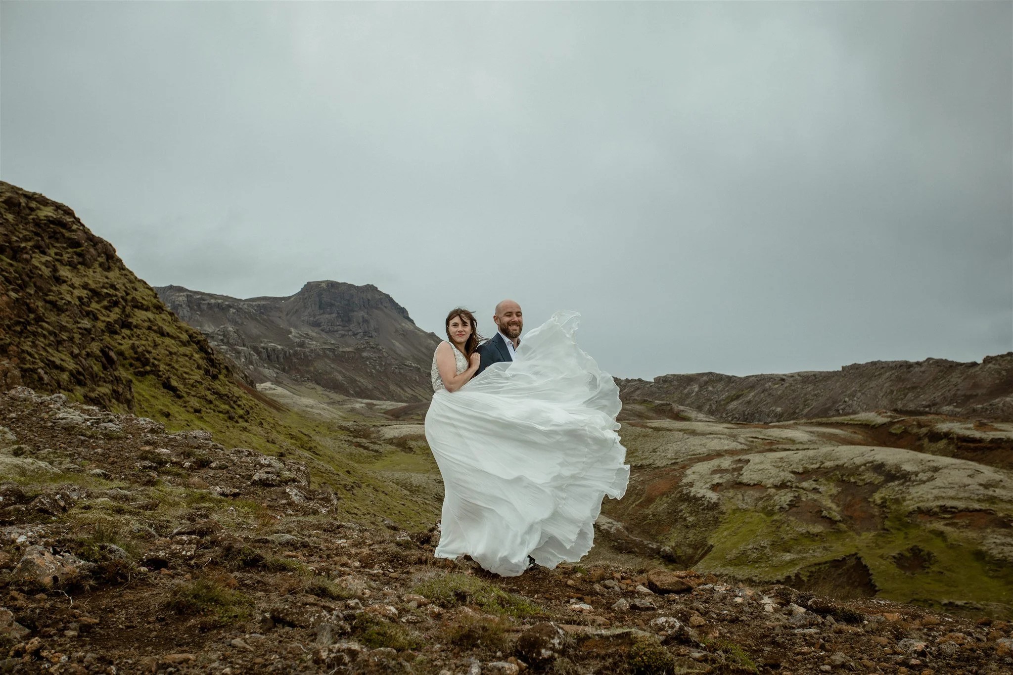  A Private Lake Iceland Elopement Starting in Reykjavík with Guests by Iceland elopement photographer &amp; planner Steph Zakas — couple on an adventure for elopement photos at a volcanic area  