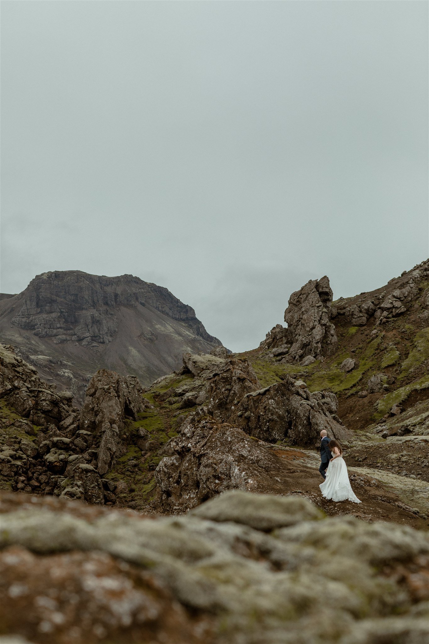  A Private Lake Iceland Elopement Starting in Reykjavík with Guests by Iceland elopement photographer &amp; planner Steph Zakas — couple on an adventure for elopement photos at a volcanic area  
