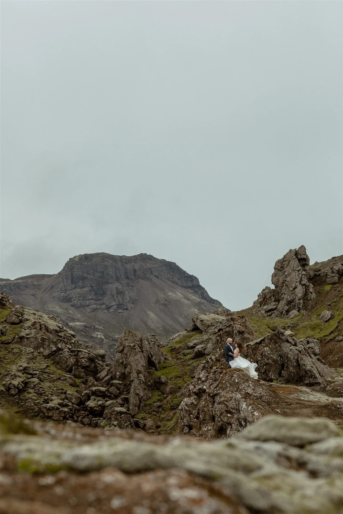  A Private Lake Iceland Elopement Starting in Reykjavík with Guests by Iceland elopement photographer &amp; planner Steph Zakas — couple on an adventure for elopement photos at a volcanic area  