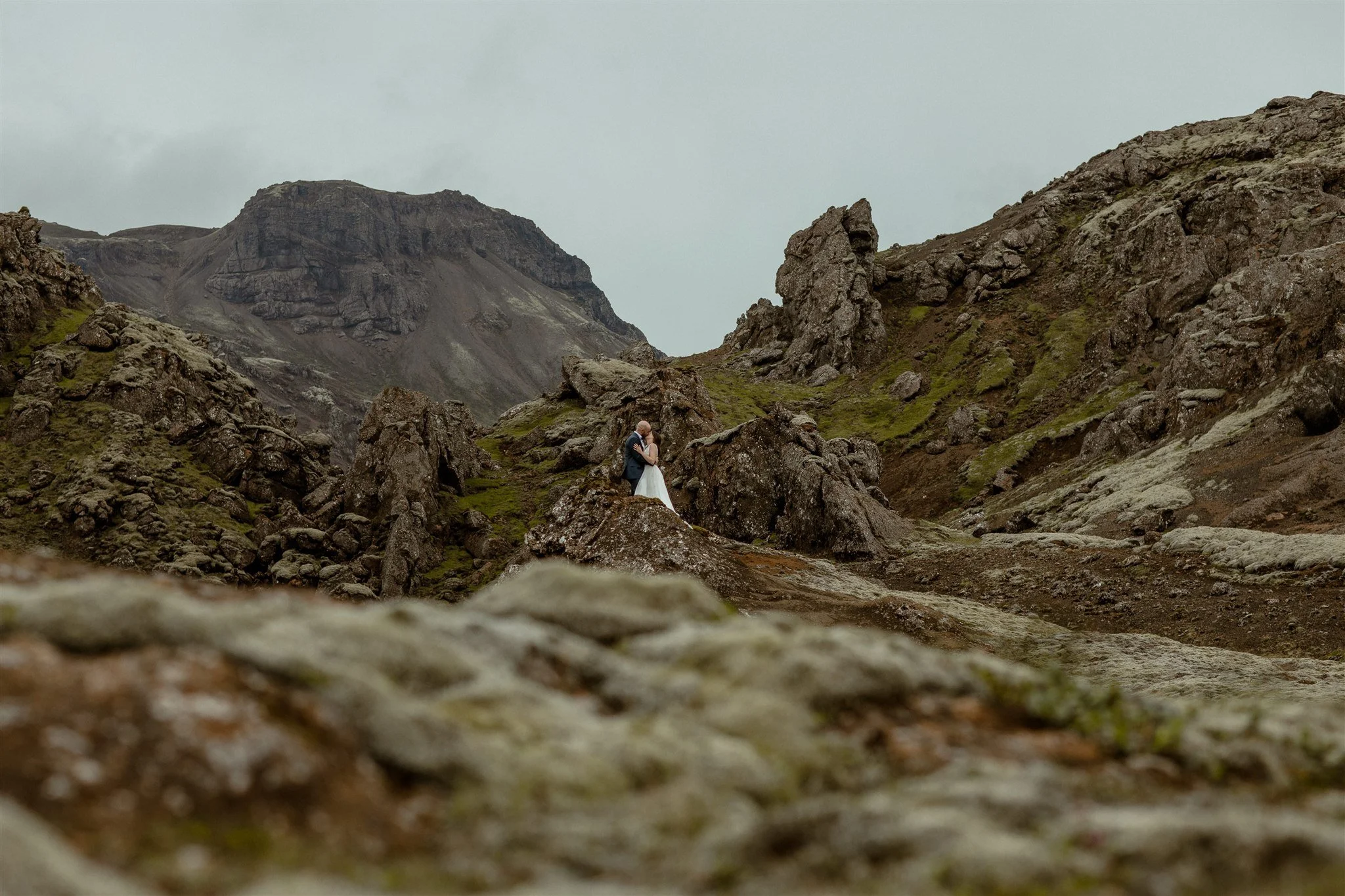  A Private Lake Iceland Elopement Starting in Reykjavík with Guests by Iceland elopement photographer &amp; planner Steph Zakas — couple on an adventure for elopement photos at a volcanic area  
