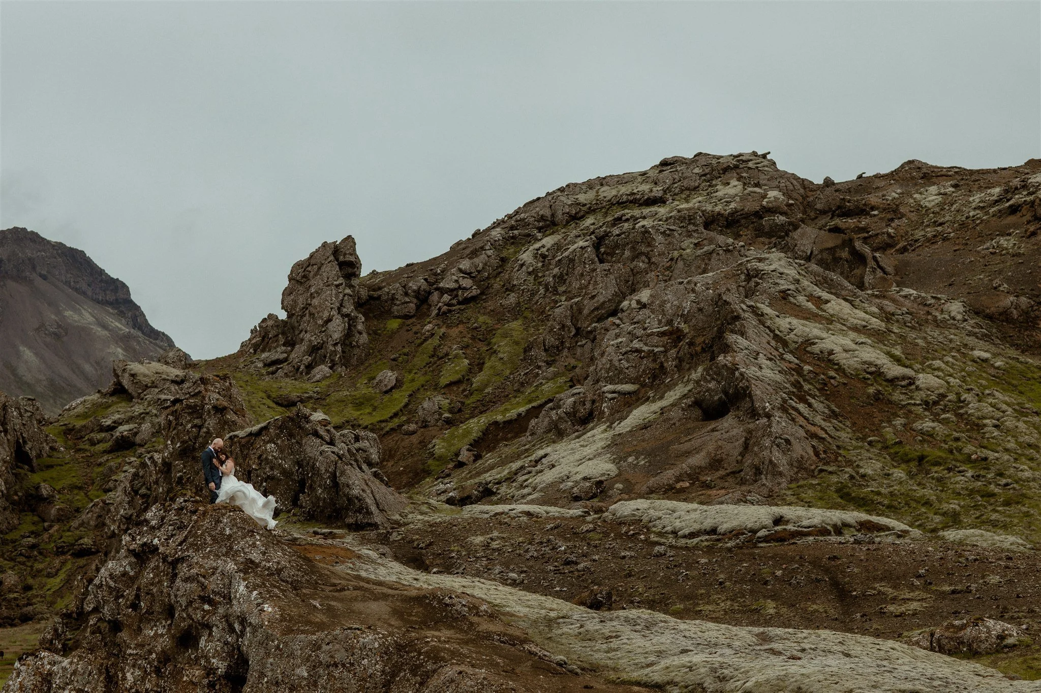  A Private Lake Iceland Elopement Starting in Reykjavík with Guests by Iceland elopement photographer &amp; planner Steph Zakas — couple on an adventure for elopement photos at a volcanic area  