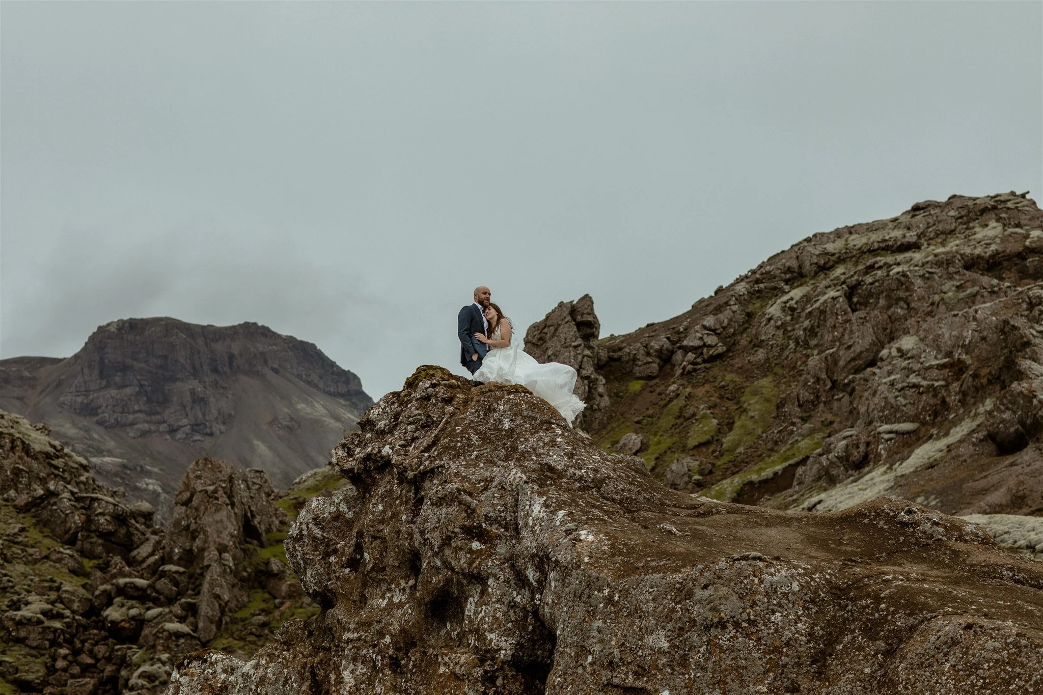  A Private Lake Iceland Elopement Starting in Reykjavík with Guests by Iceland elopement photographer &amp; planner Steph Zakas — couple on an adventure for elopement photos at a volcanic area  