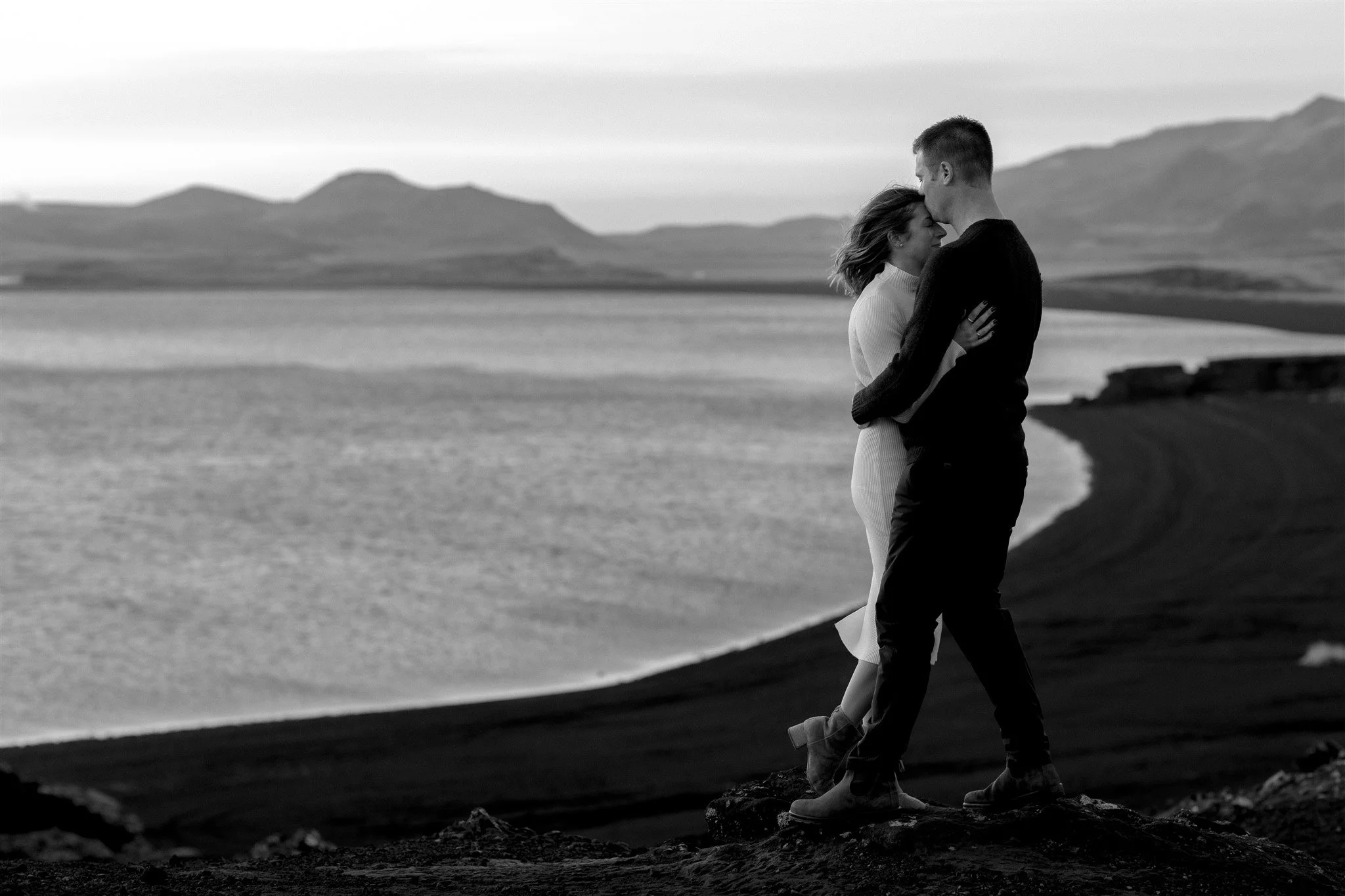  Iceland engagement photo with sunrise dreamy light with couple by water by Iceland engagement proposal photographer steph zakas 