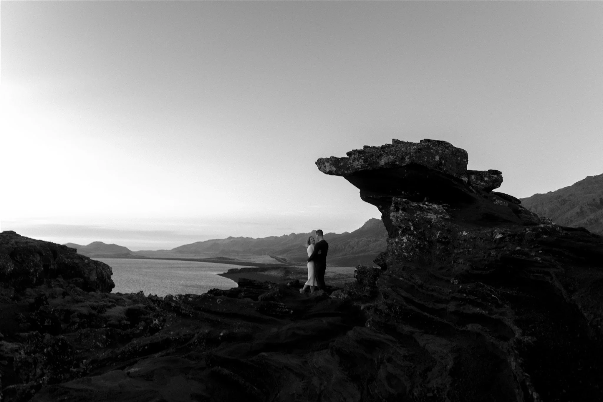  Iceland engagement photo with sunrise dreamy light with couple by water by Iceland engagement proposal photographer steph zakas 