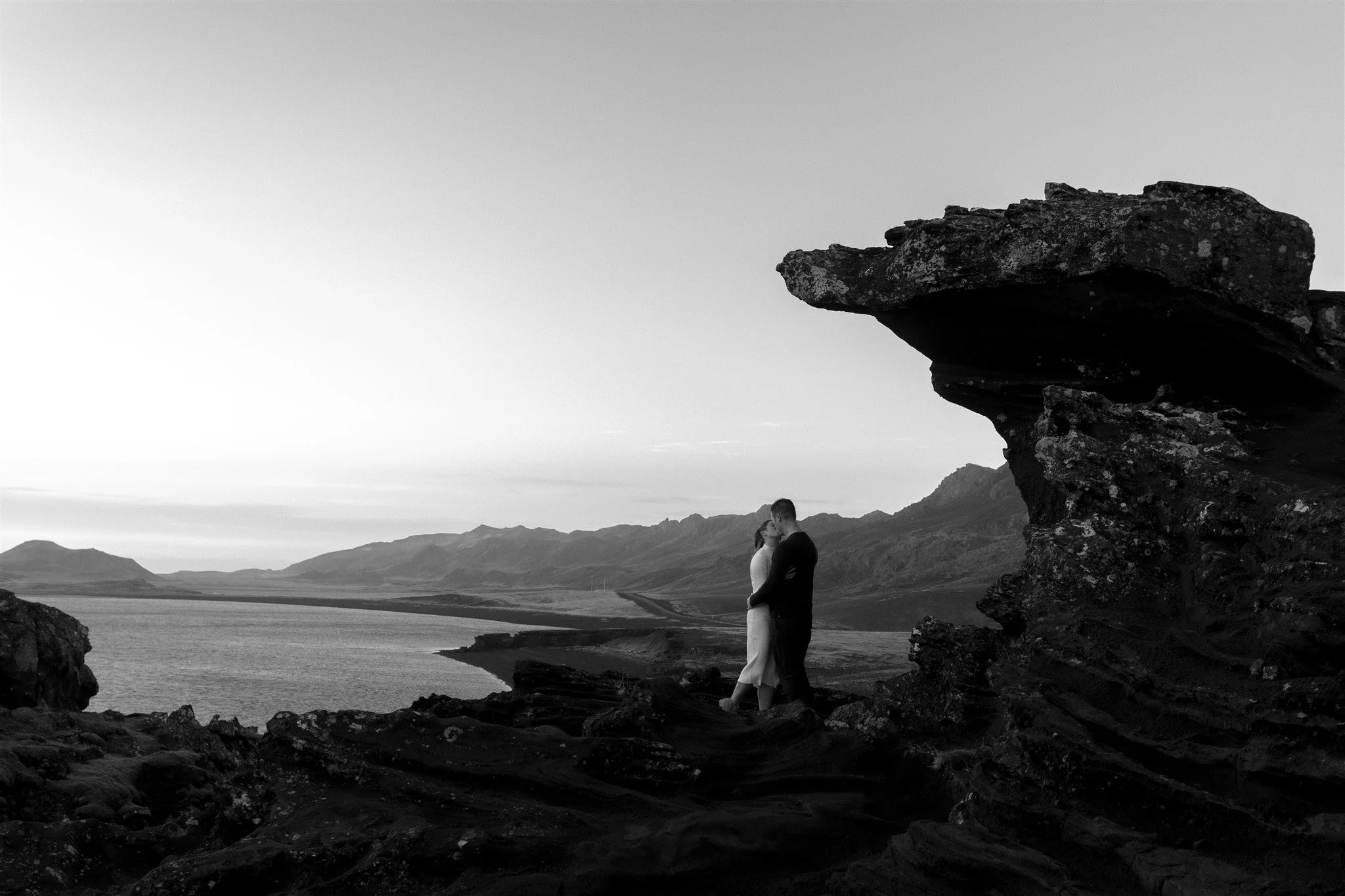  Iceland engagement photo with sunrise dreamy light with couple by water by Iceland engagement proposal photographer steph zakas 