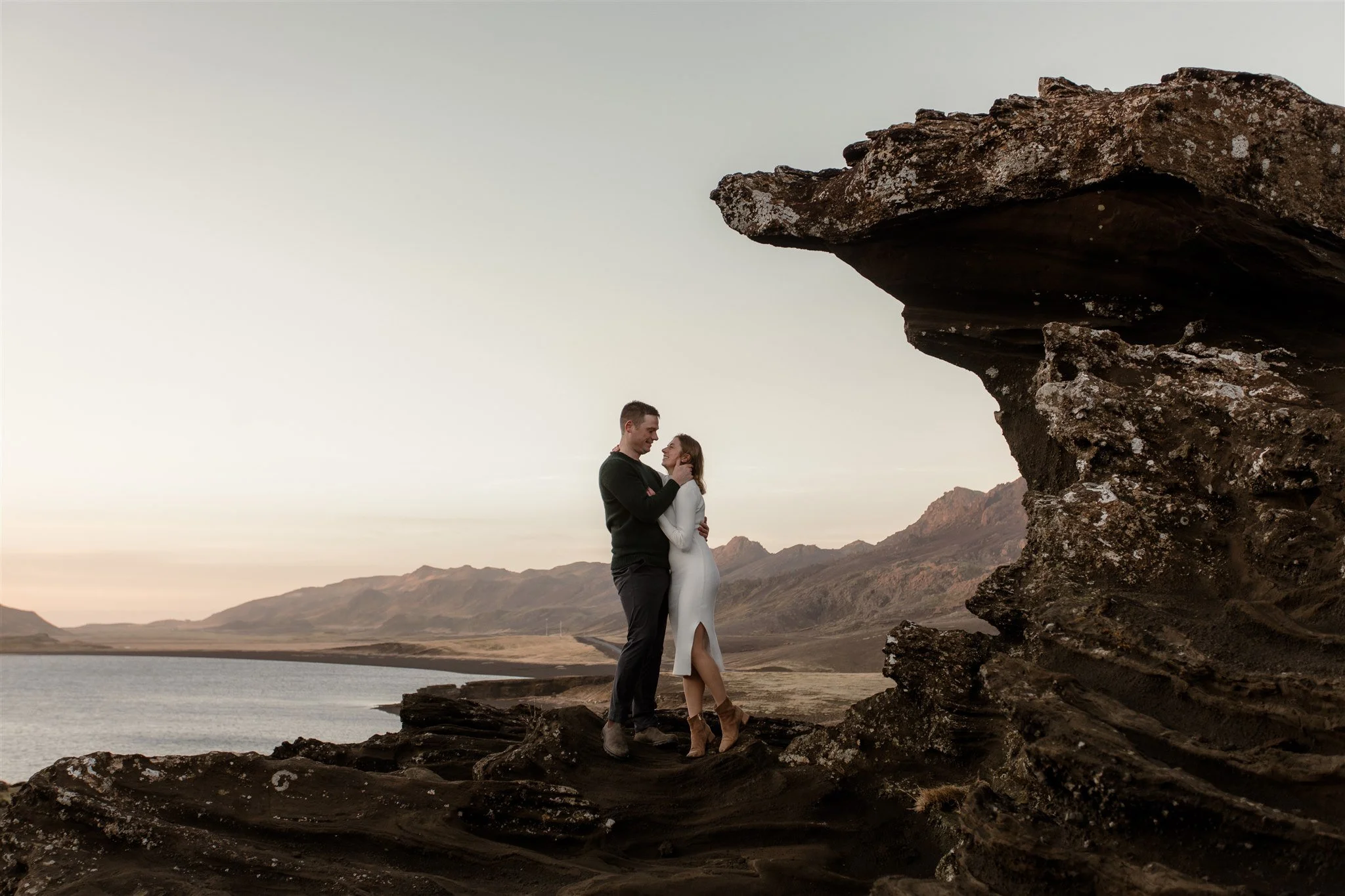  Iceland engagement photo with sunrise dreamy light with couple by water by Iceland engagement proposal photographer steph zakas 
